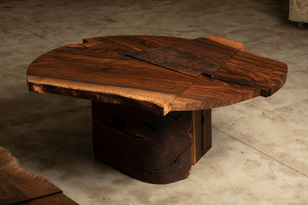 https://a.1stdibscdn.com/claro-walnut-single-slab-strike-slip-round-dining-table-for-sale-picture-2/f_23463/1613606002592/Strike_Slip_Round_VI_Top_Corner_Front_R_master.jpg
