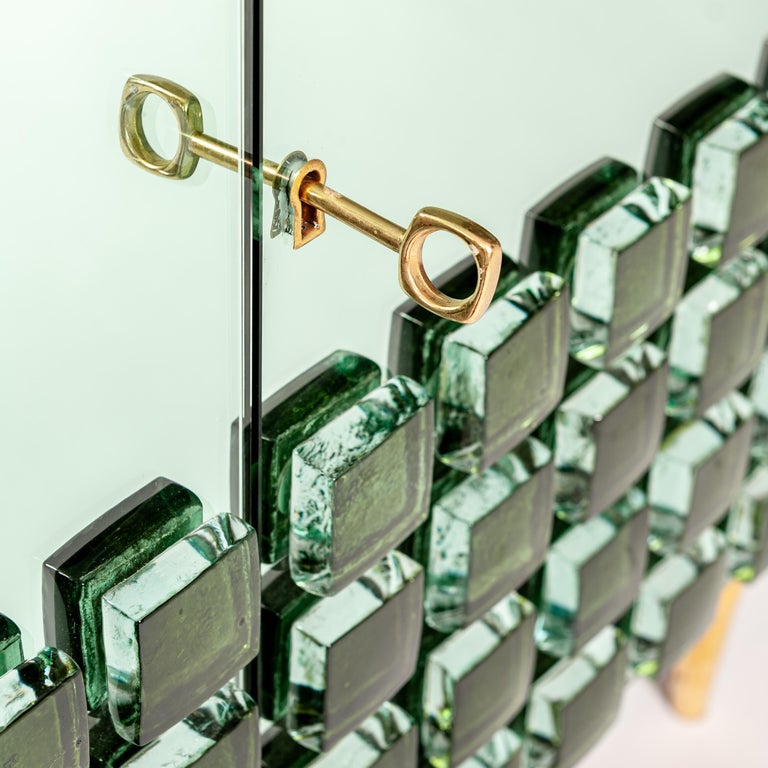 https://a.1stdibscdn.com/italian-studio-made-mirrored-emerald-green-cabinet-hand-cast-opal-glass-stones-for-sale-picture-6/f_24383/f_469677321759934292435/StudioNo5_1870_master.jpg?width=768