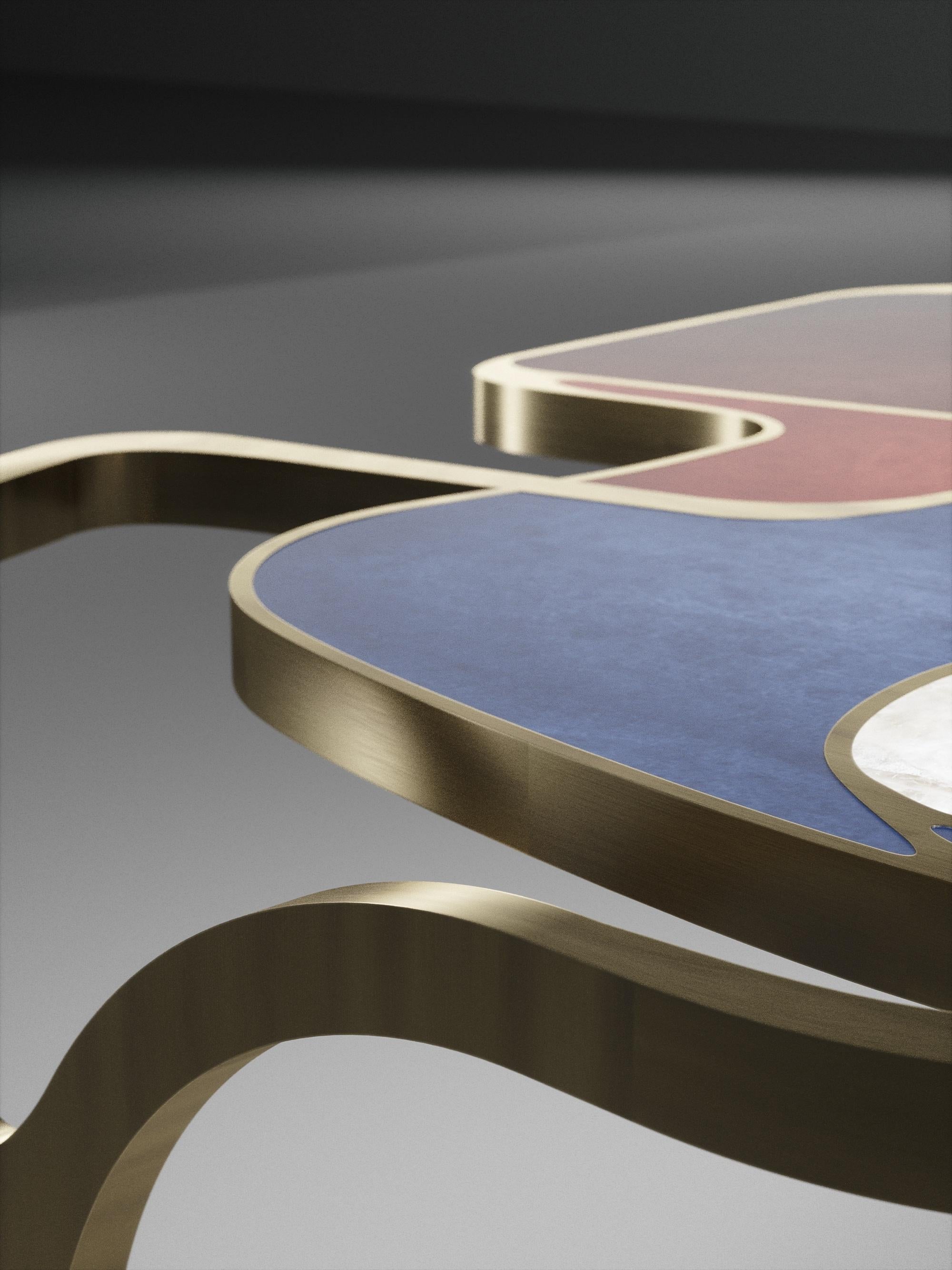 https://a.1stdibscdn.com/parchment-cocteau-coffee-table-with-brass-accents-by-r-y-augousti-for-sale-picture-3/f_45491/f_227975621614949402179/TABLE_BASSE_Cocteau_D10013_master.jpg