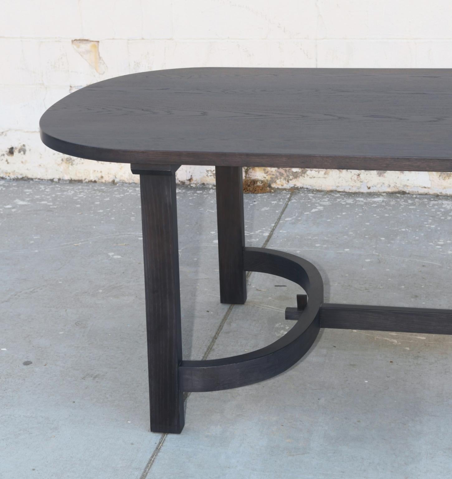 https://a.1stdibscdn.com/oak-racetrack-table-with-curved-stretcher-for-sale-picture-6/f_8065/1575554270471/TTR1_2_master.jpg