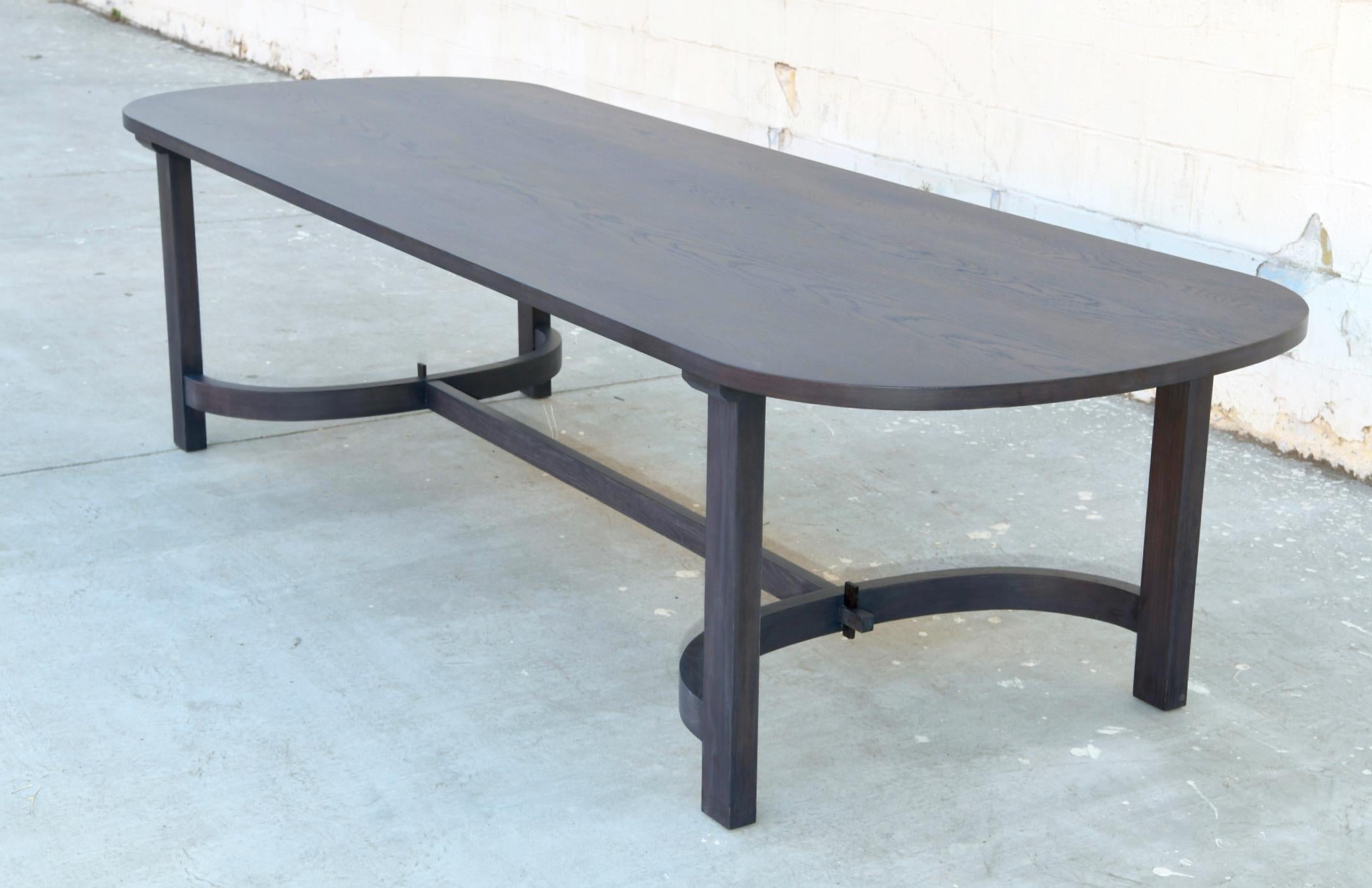 https://a.1stdibscdn.com/oak-racetrack-table-with-curved-stretcher-for-sale-picture-2/f_8065/1575554274207/TTR1_4_master.jpg