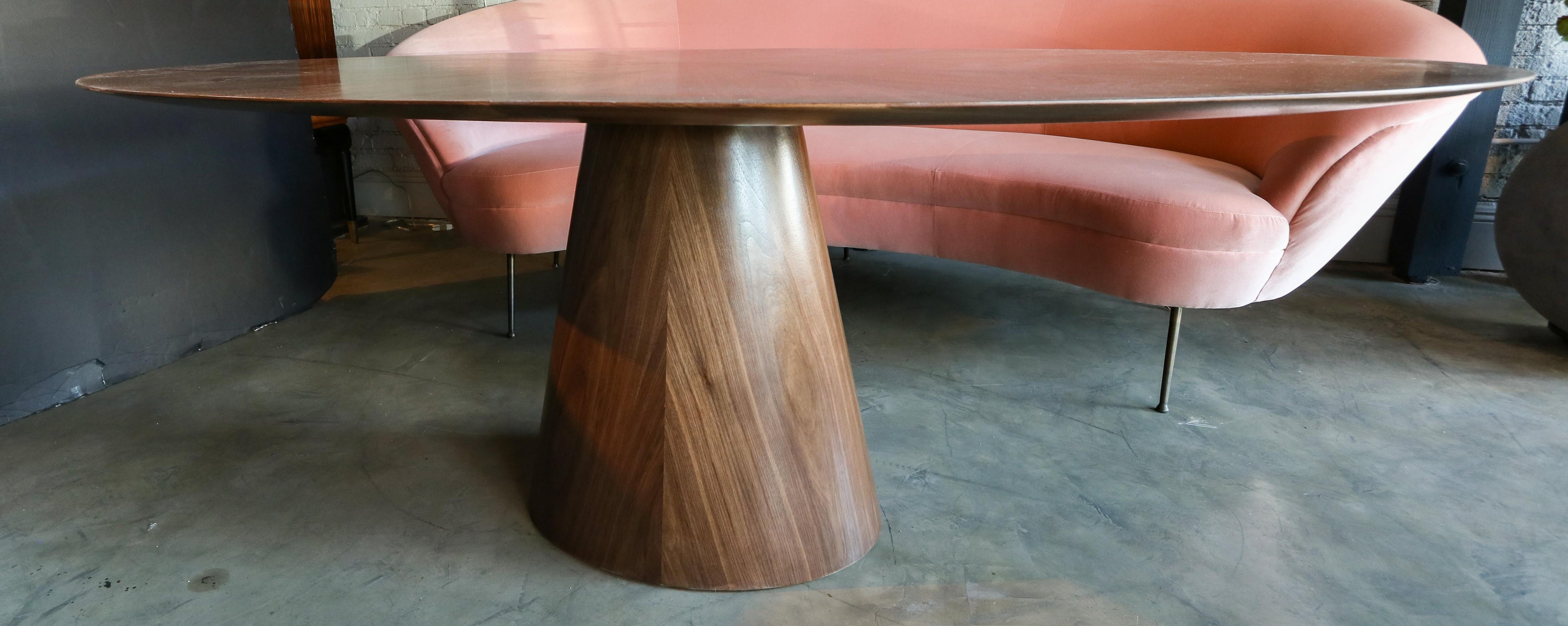 https://a.1stdibscdn.com/custom-mid-century-style-walnut-oval-dining-table-with-pedestal-base-for-sale-picture-6/f_8175/f_268673321641951236953/T_406_7_master.jpg