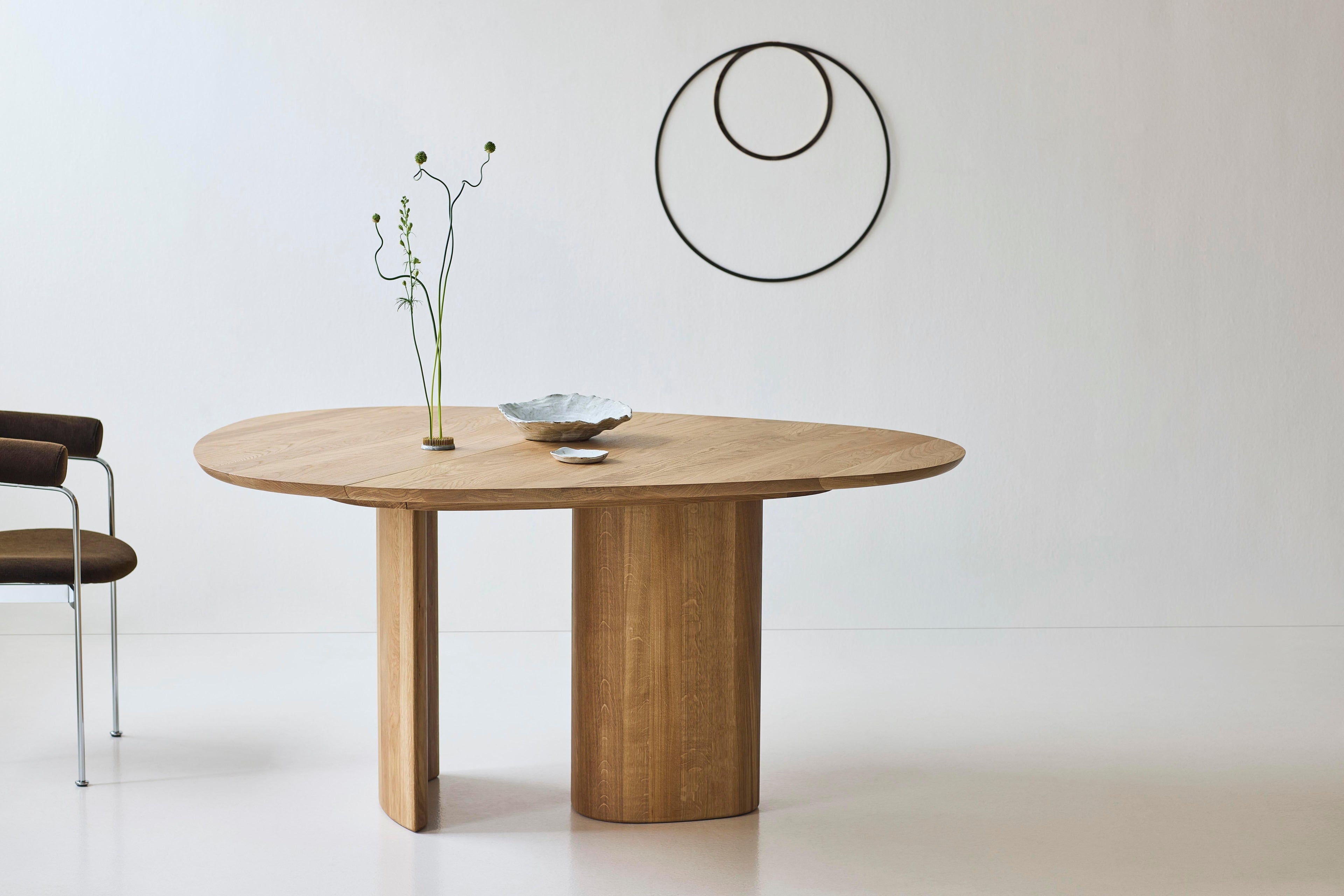 https://a.1stdibscdn.com/contemporary-round-dining-table-tangent-by-anne-boysen-x-dk3-oil-white-oak-for-sale-picture-8/f_31233/f_456073921750862298349/Tangent_Table_oak_oil_Baia_Chair_Alpaca1110_Chrome_2_low_master.jpg