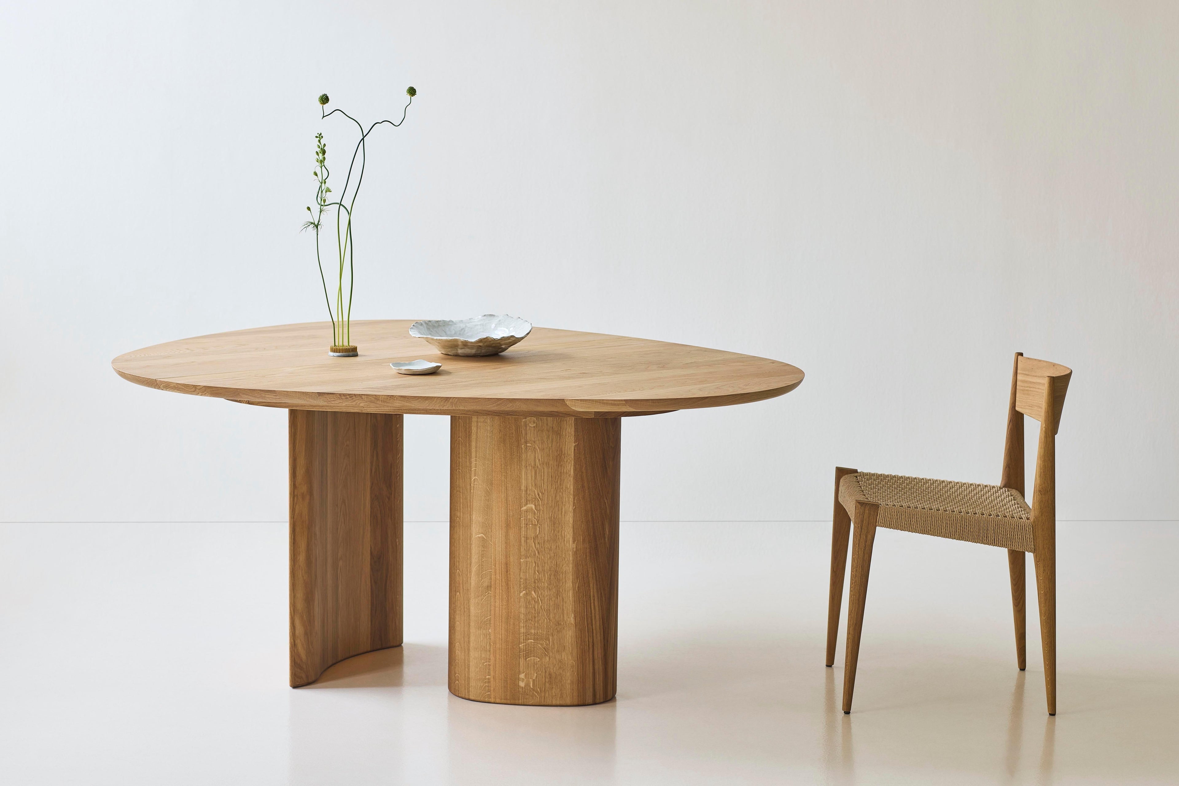 https://a.1stdibscdn.com/contemporary-round-dining-table-tangent-by-anne-boysen-x-dk3-oil-white-oak-for-sale-picture-9/f_31233/f_456073921750862299087/Tangent_Table_oak_oil_Pia_Chair_oak_oil_1_low_master.jpg