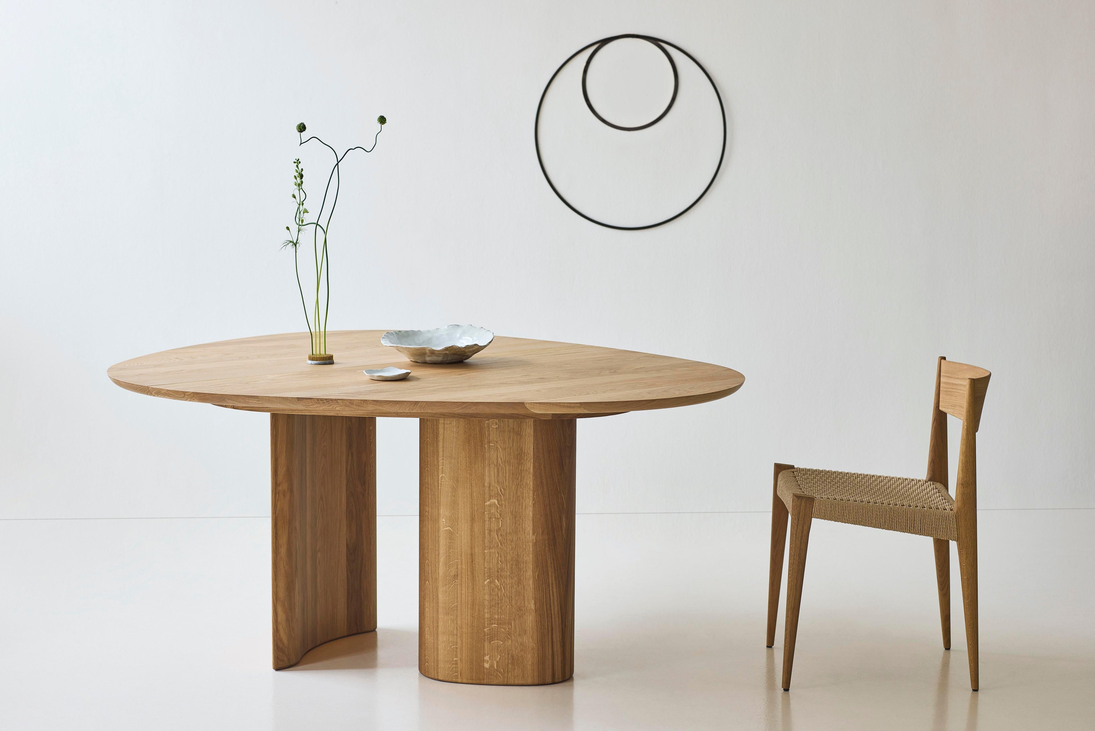 https://a.1stdibscdn.com/contemporary-round-dining-table-tangent-by-anne-boysen-x-dk3-soap-oak-for-sale-picture-11/f_31233/f_456067421750860878536/Tangent_Table_oak_oil_Pia_Chair_oak_oil_2_low_master.jpg