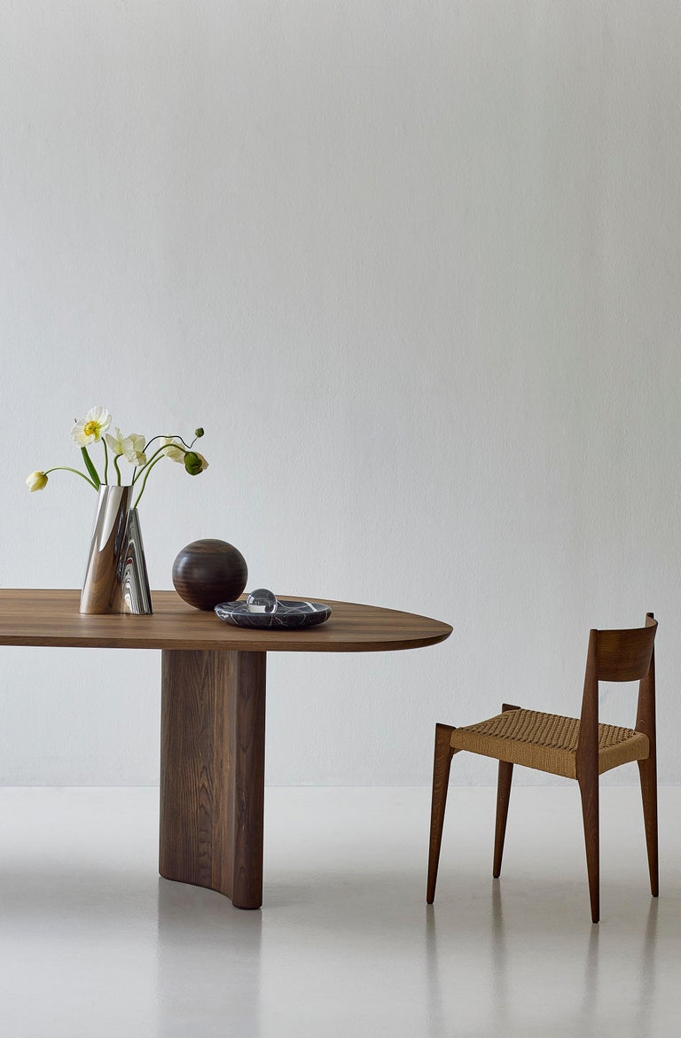 https://a.1stdibscdn.com/contemporary-rectangular-dining-table-tangent-by-dk3-oiled-white-oak-270-cm-for-sale-picture-11/f_31233/f_458107521752143466246/Tangent_Table_rect_smoked_oak_Pia_Chair_smoked_oak_1_low_master.jpg?width=768