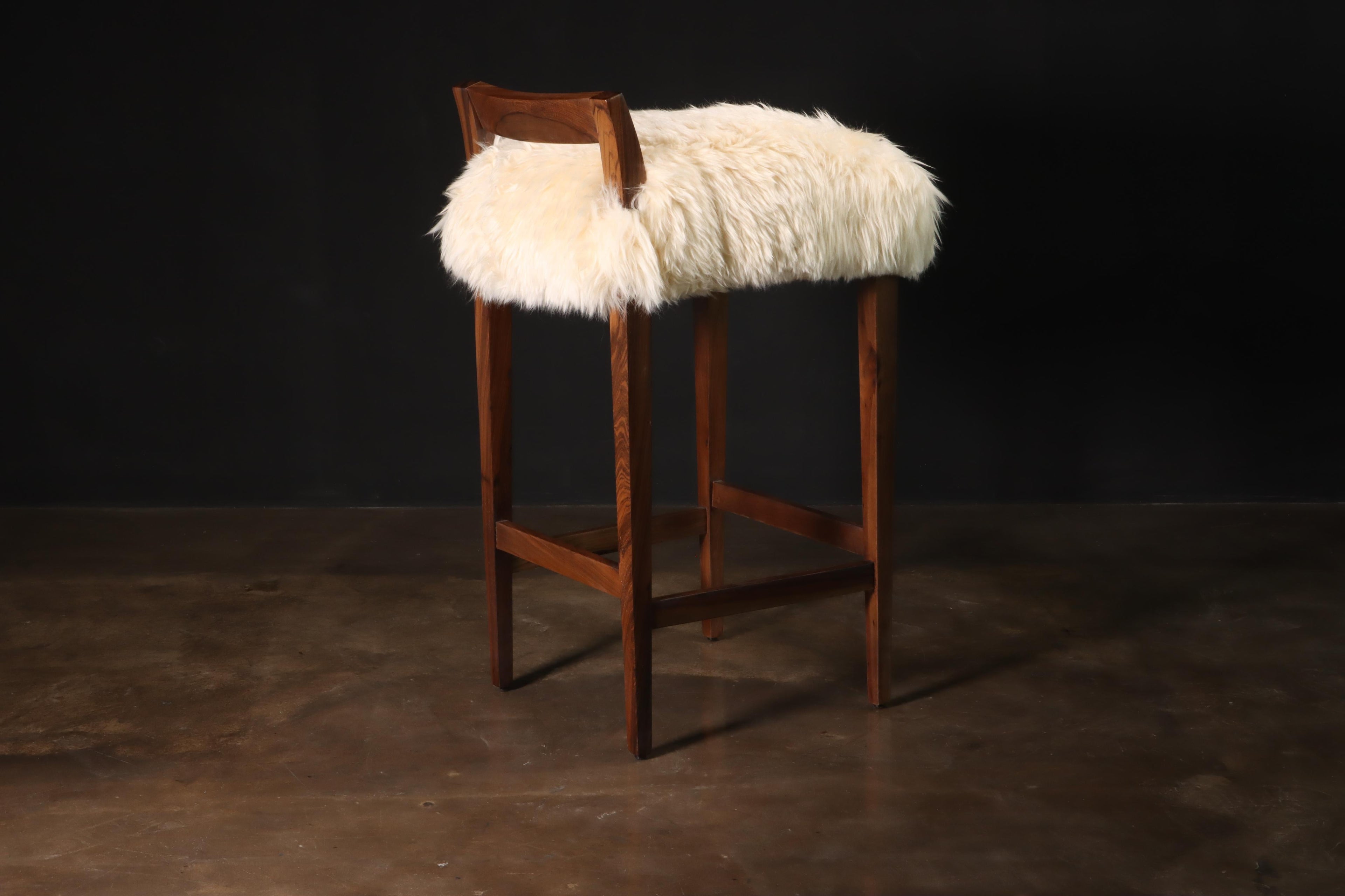 https://a.1stdibscdn.com/sheepskin-and-exotic-wood-contemporary-low-back-stool-from-costantini-umberto-for-sale-picture-3/f_25173/f_318617921671644797714/Umberto_Stool_in_Sheepskin_by_Costantini_01_master.JPG