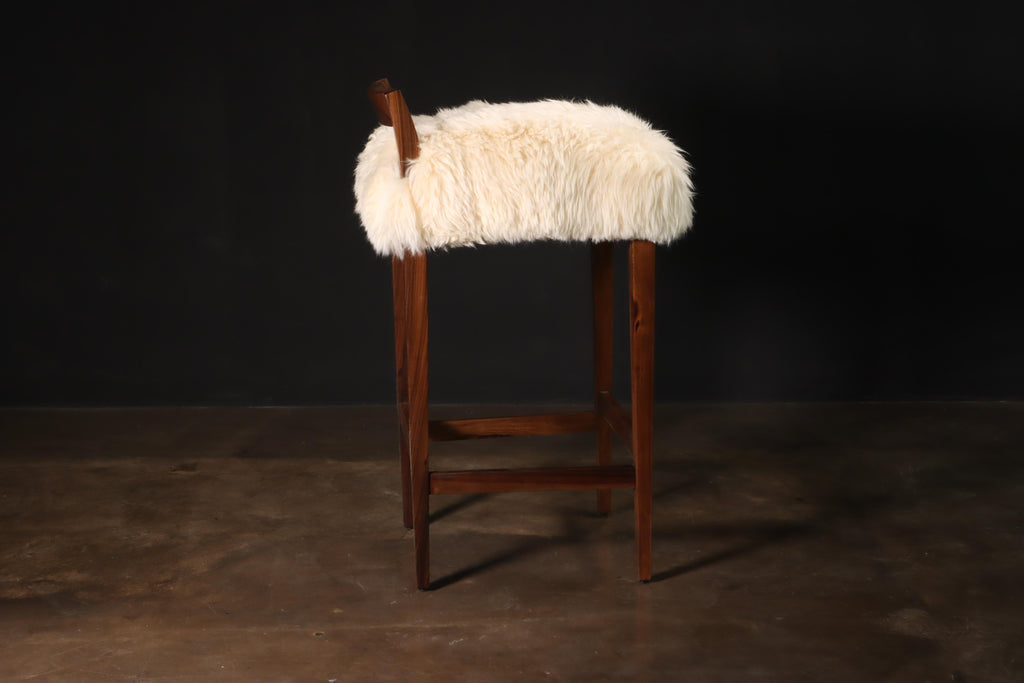 https://a.1stdibscdn.com/sheepskin-and-exotic-wood-contemporary-low-back-stool-from-costantini-umberto-for-sale-picture-4/f_25173/f_318617921671644798414/Umberto_Stool_in_Sheepskin_by_Costantini_02_master.JPG