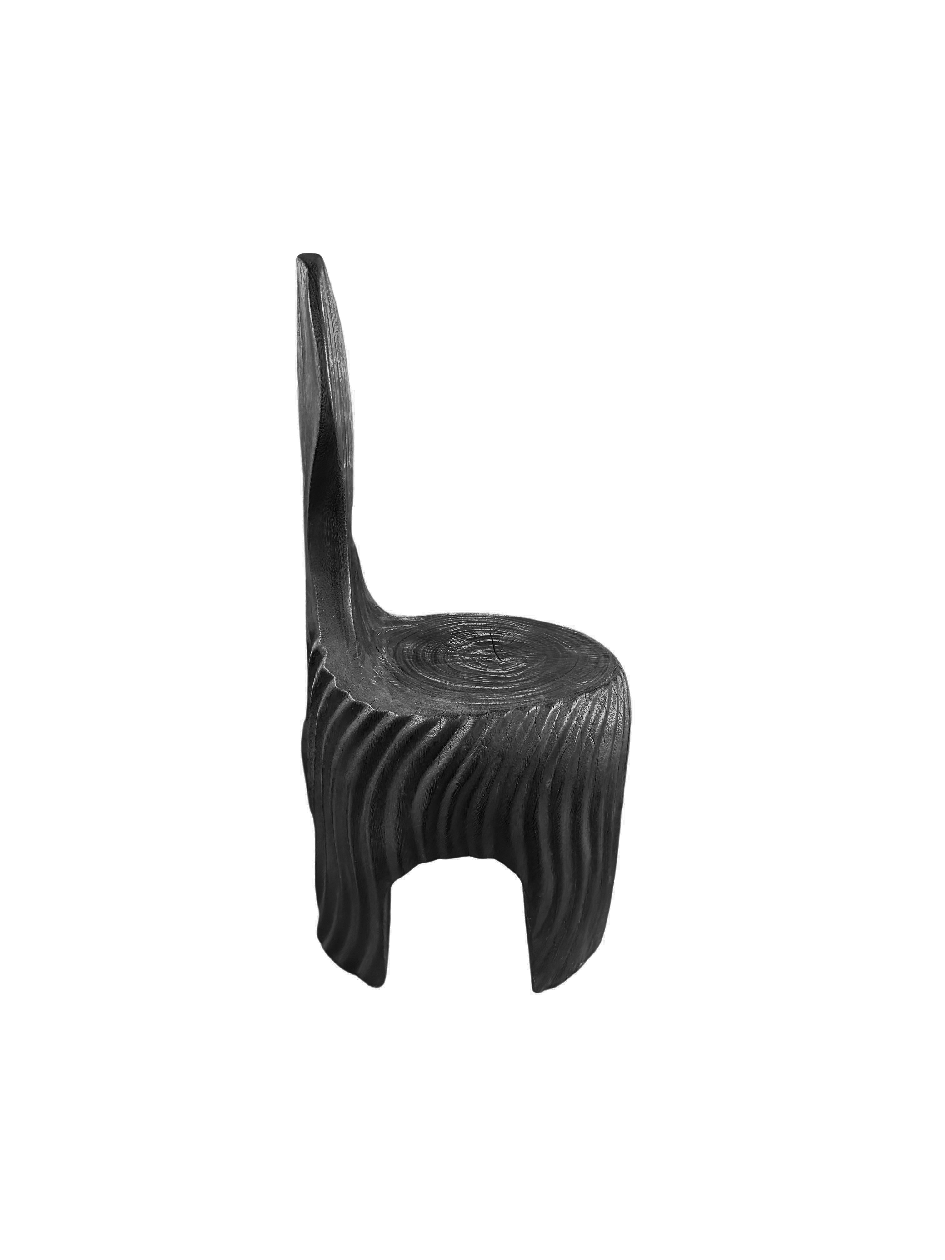 https://a.1stdibscdn.com/sculptural-mango-wood-chair-with-carved-detailing-modern-organic-burnt-finish-for-sale-picture-4/f_58812/f_420683221730129712409/Untitled_design_2024_10_28T202857_151_master.jpg