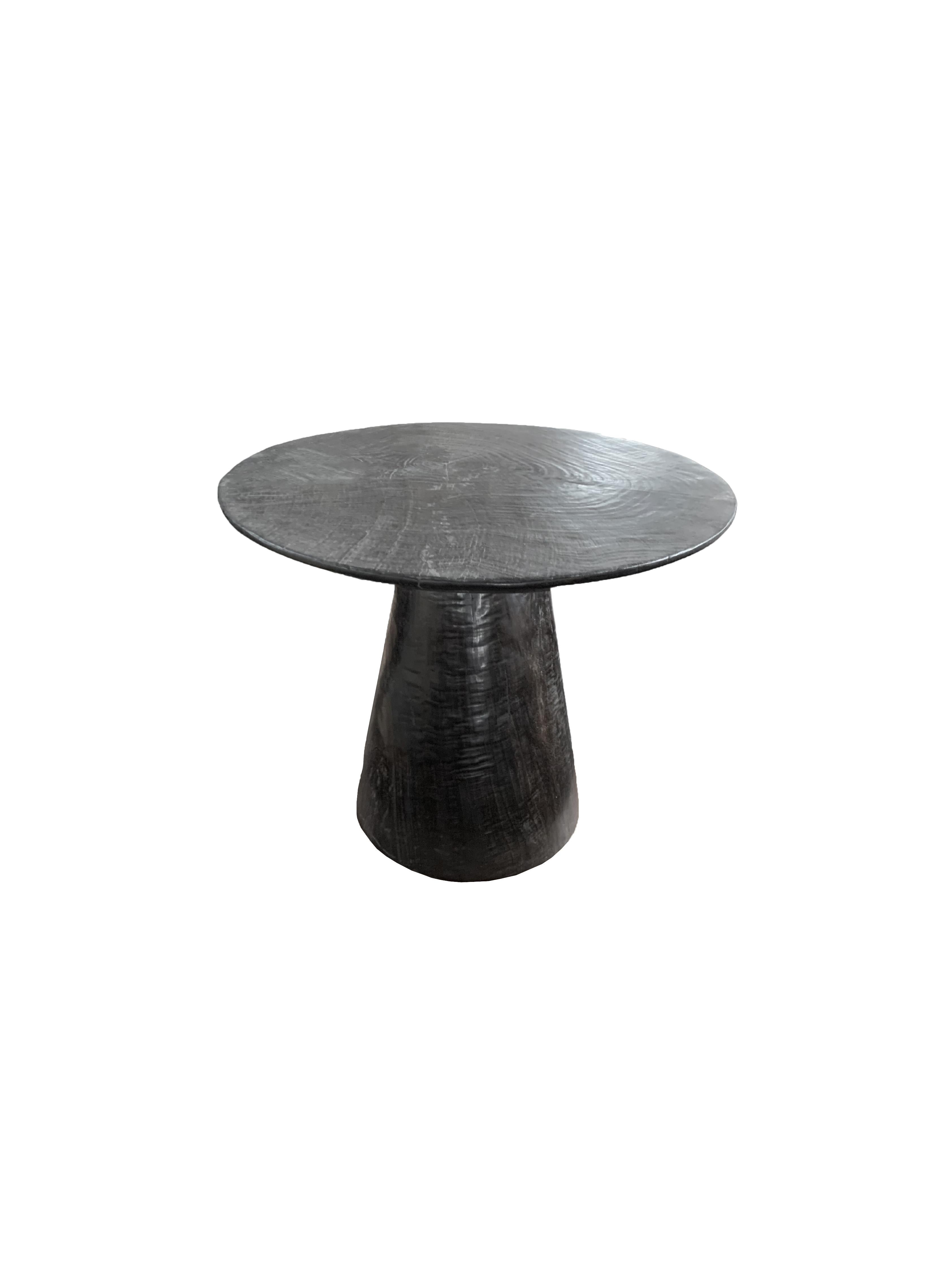 https://a.1stdibscdn.com/sculptural-round-table-crafted-from-mango-wood-burnt-finish-modern-organic-for-sale-picture-4/f_58812/f_295375221657627830119/Untitled_design_59__master.jpg