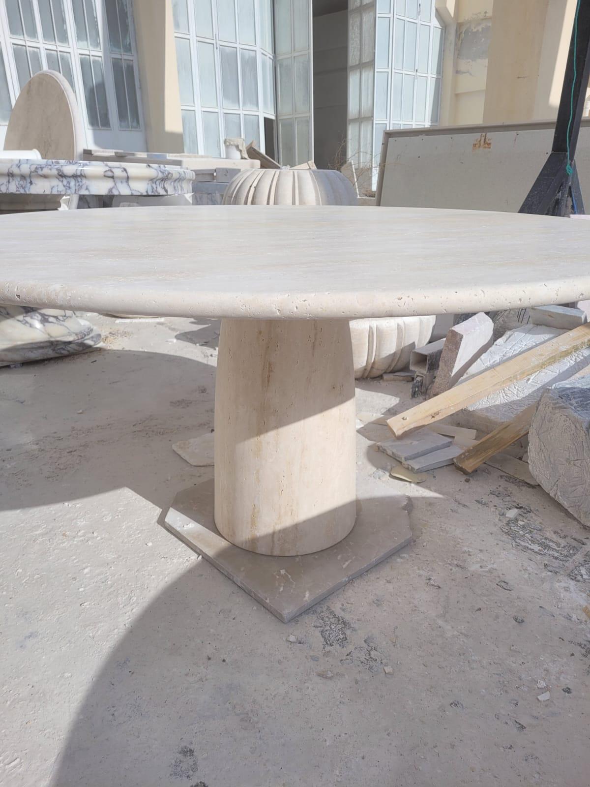 https://a.1stdibscdn.com/cream-travertine-round-dining-table-in-the-style-of-1970-angelo-mangiarotti-for-sale-picture-2/f_80522/f_387595821709906022588/WhatsApp_Image_2024_03_06_at_23_14_25_master.jpeg