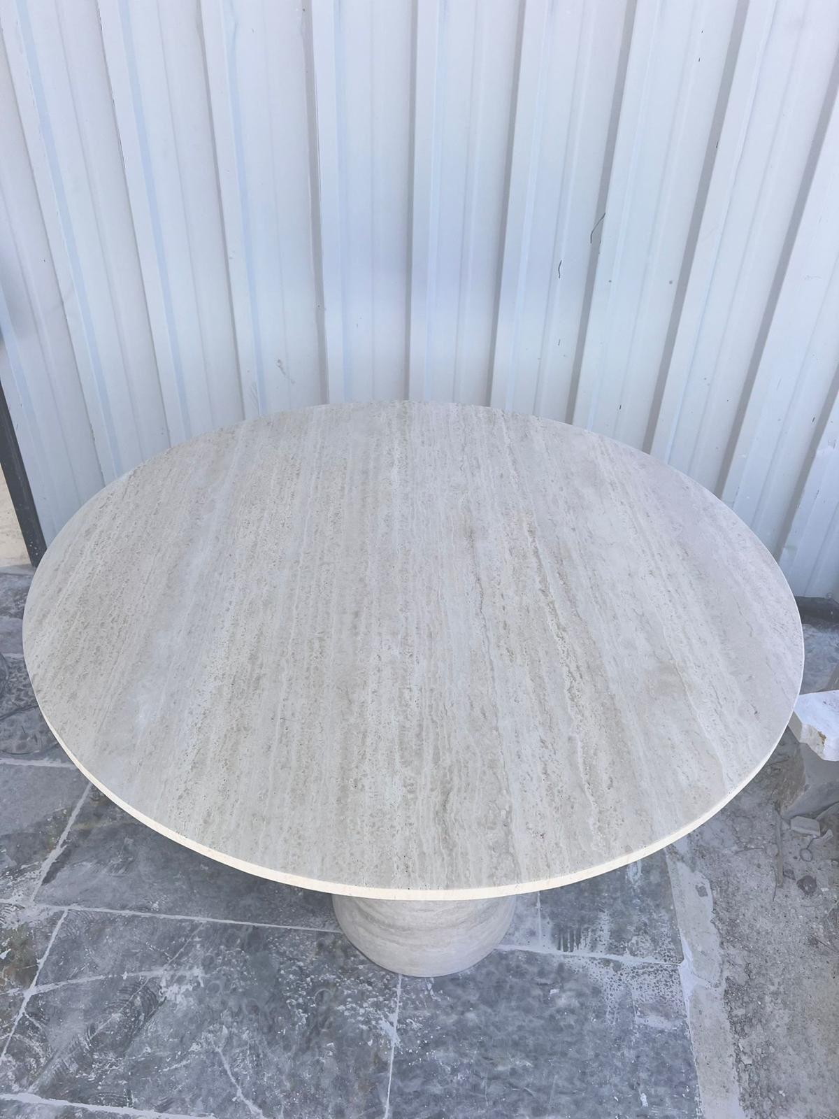 https://a.1stdibscdn.com/round-travertine-dining-table-white-marble-round-table-round-marble-table-for-sale-picture-7/f_91932/f_422252921731069181689/WhatsApp_Image_2024_11_08_at_15_32_00_master.jpeg