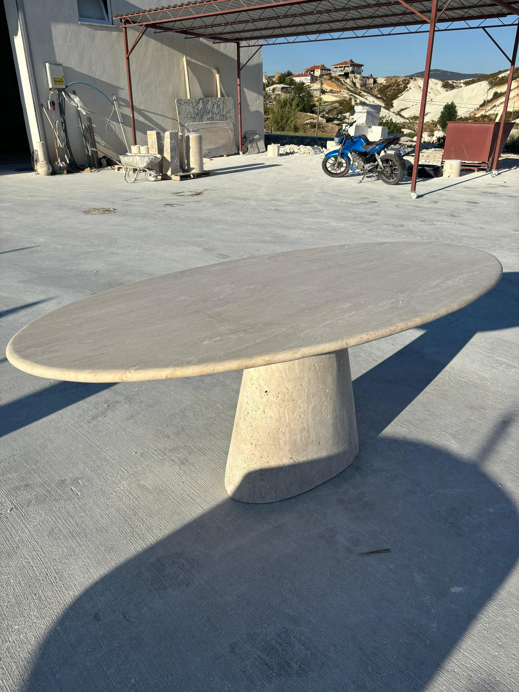 https://a.1stdibscdn.com/modern-ellips-italian-travertine-dining-table-natural-marble-kitchen-table-for-sale-picture-4/f_91932/f_453973721749559271082/WhatsApp_Image_2025_05_07_at_14_22_14_master.jpeg