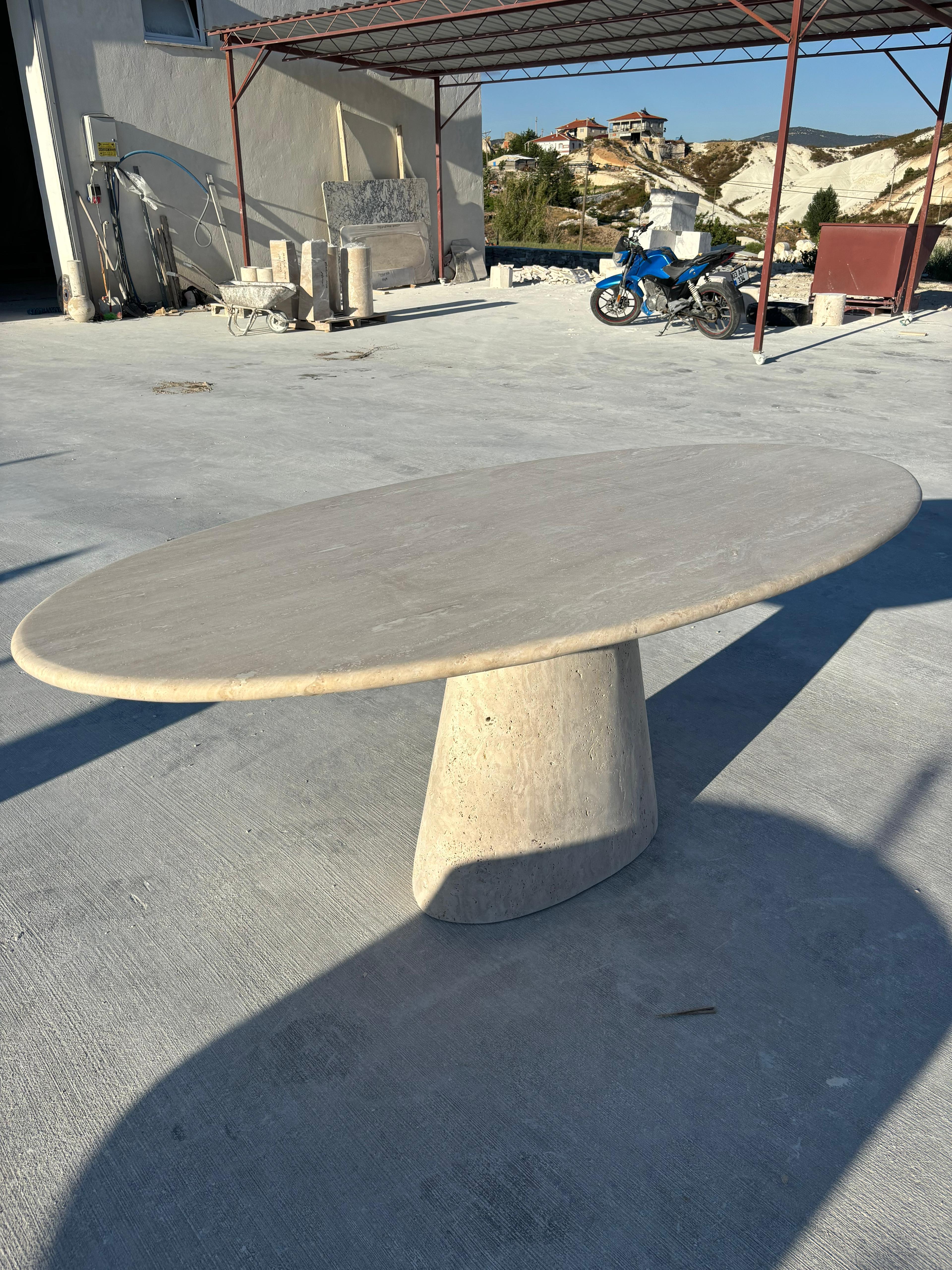 https://a.1stdibscdn.com/modern-ellips-italian-travertine-dining-table-natural-marble-kitchen-table-for-sale-picture-4/f_91932/f_453973721749559271082/WhatsApp_Image_2025_05_07_at_14_22_14_master.jpeg