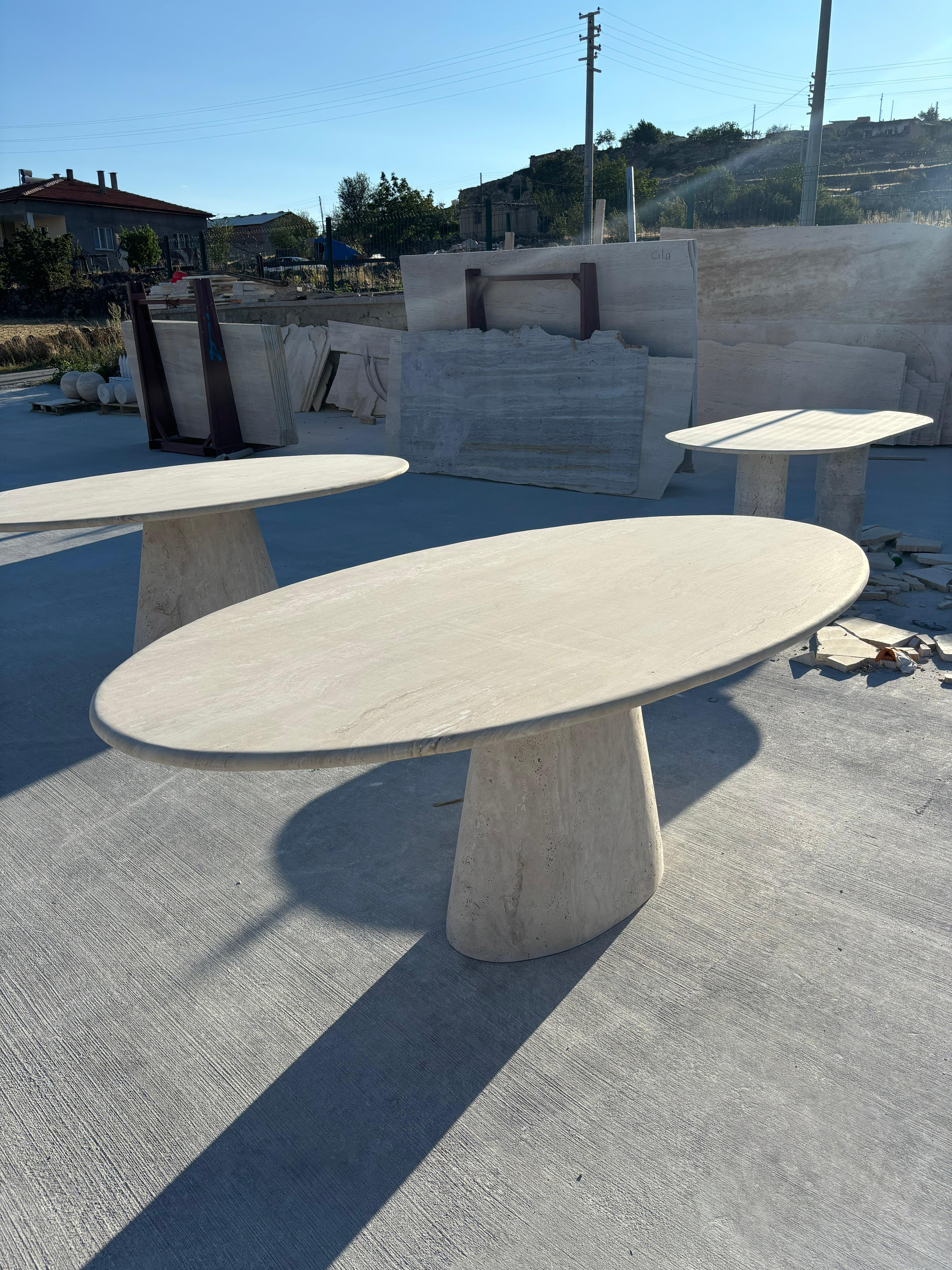 https://a.1stdibscdn.com/modern-ellips-italian-travertine-dining-table-natural-marble-kitchen-table-for-sale-picture-3/f_91932/f_453973721749559269569/WhatsApp_Image_2025_05_07_at_14_23_23_1__master.jpeg
