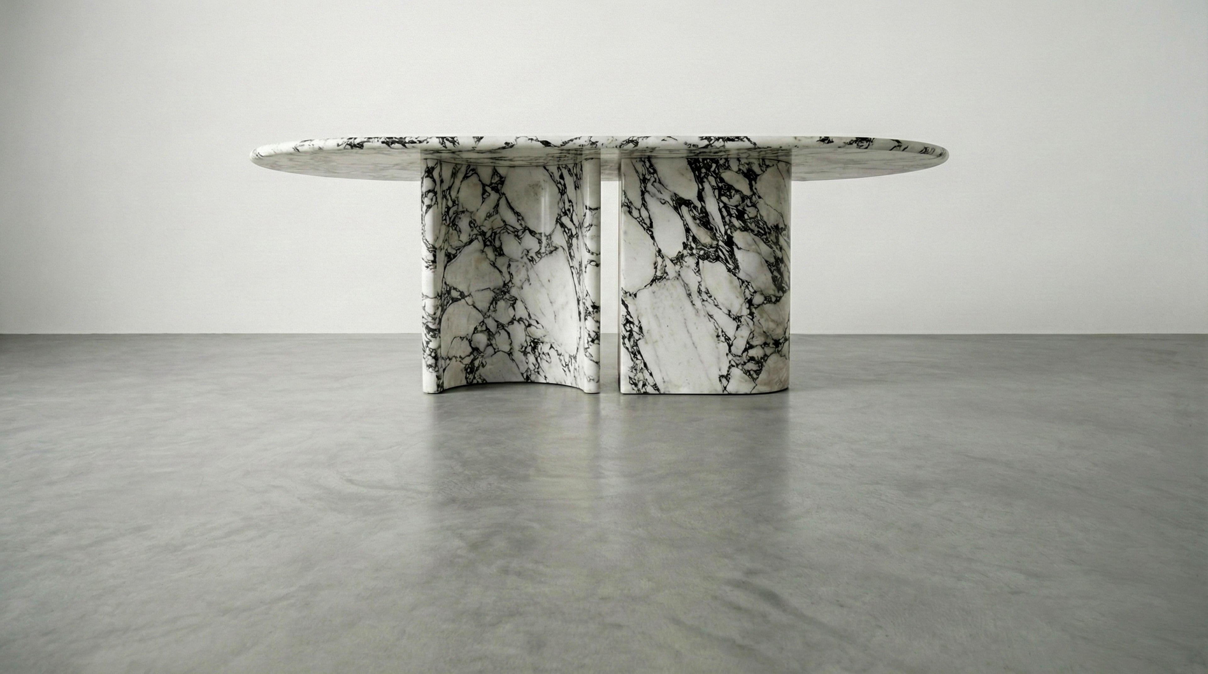 https://a.1stdibscdn.com/calacatta-viola-marble-dining-table-with-sculptural-stone-base-monolith-table-for-sale-picture-2/f_91932/f_478481721764923994254/WhatsApp_Image_2025_12_05_at_10_55_59_1__master.jpeg