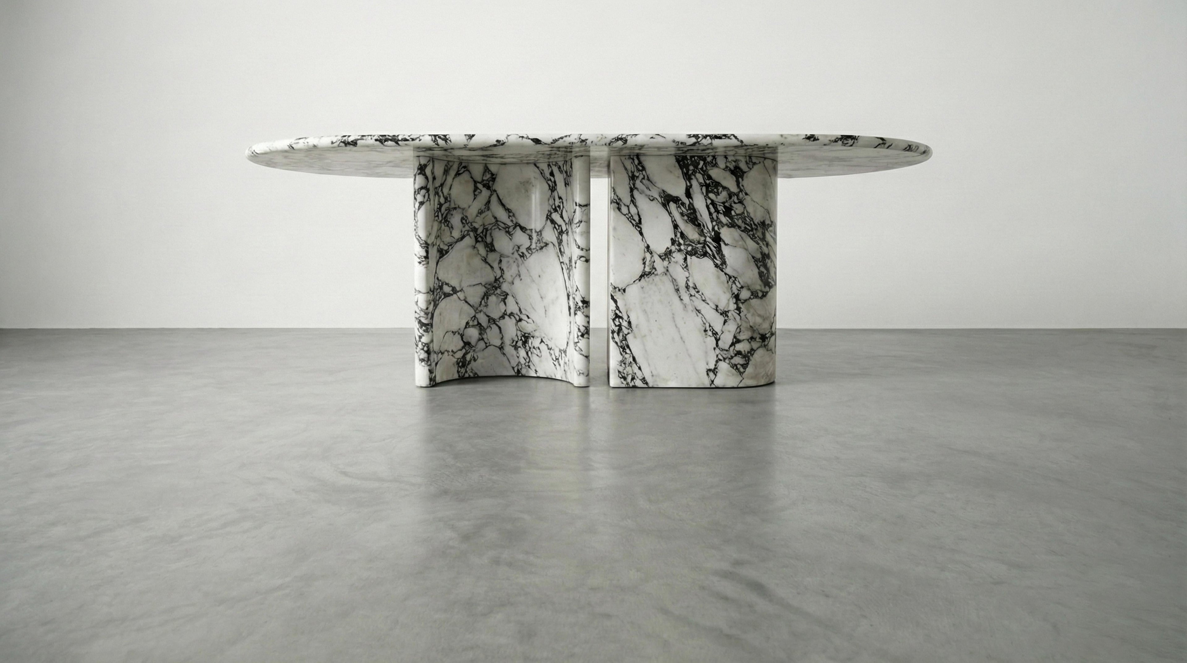 https://a.1stdibscdn.com/calacatta-viola-marble-dining-table-with-sculptural-stone-base-monolith-table-for-sale-picture-3/f_91932/f_478481721764923994116/WhatsApp_Image_2025_12_05_at_10_55_59_master.jpeg