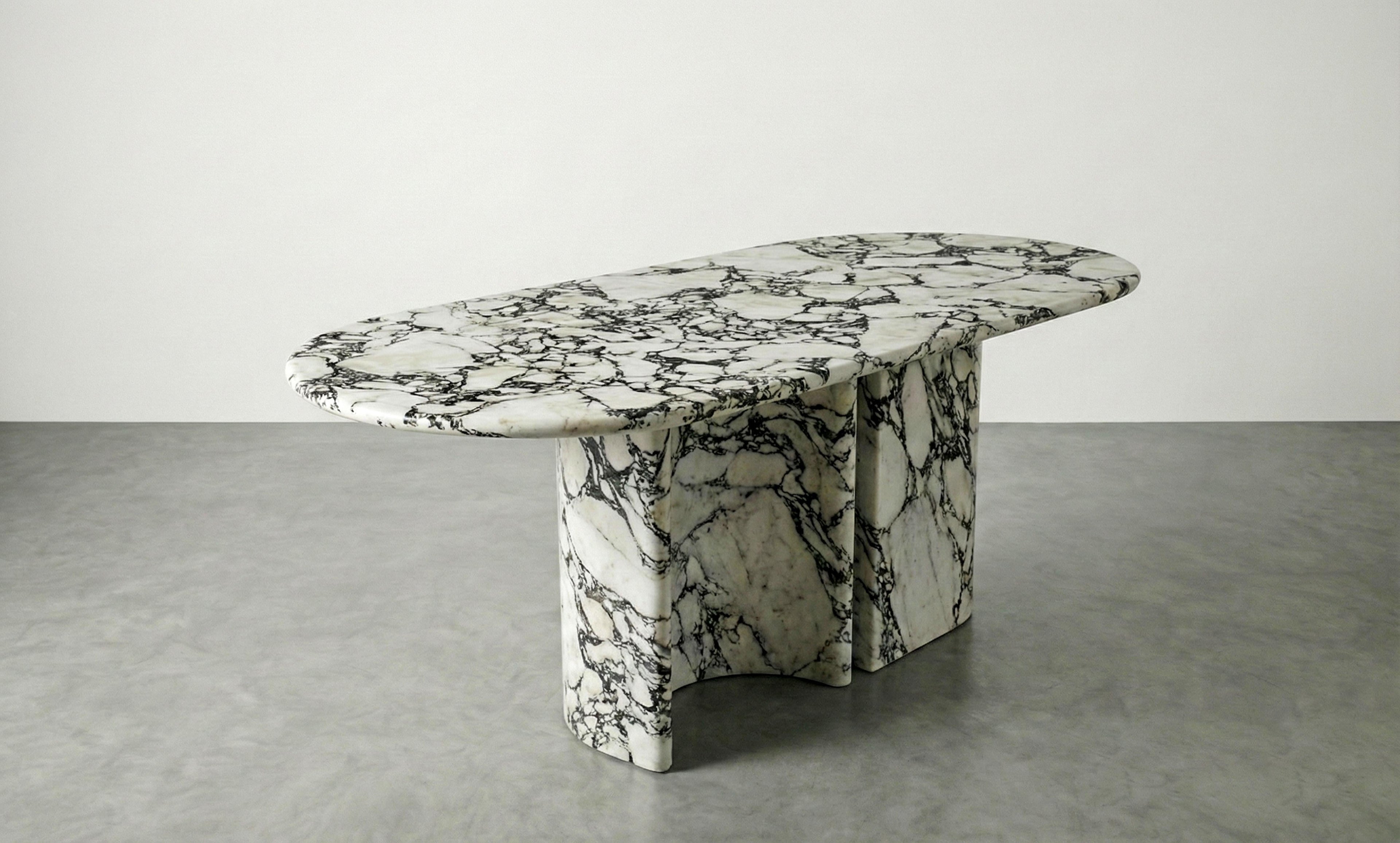 https://a.1stdibscdn.com/calacatta-viola-marble-dining-table-with-sculptural-stone-base-monolith-table-for-sale-picture-7/f_91932/f_478481721764923994594/WhatsApp_Image_2025_12_05_at_10_56_00_master.jpeg