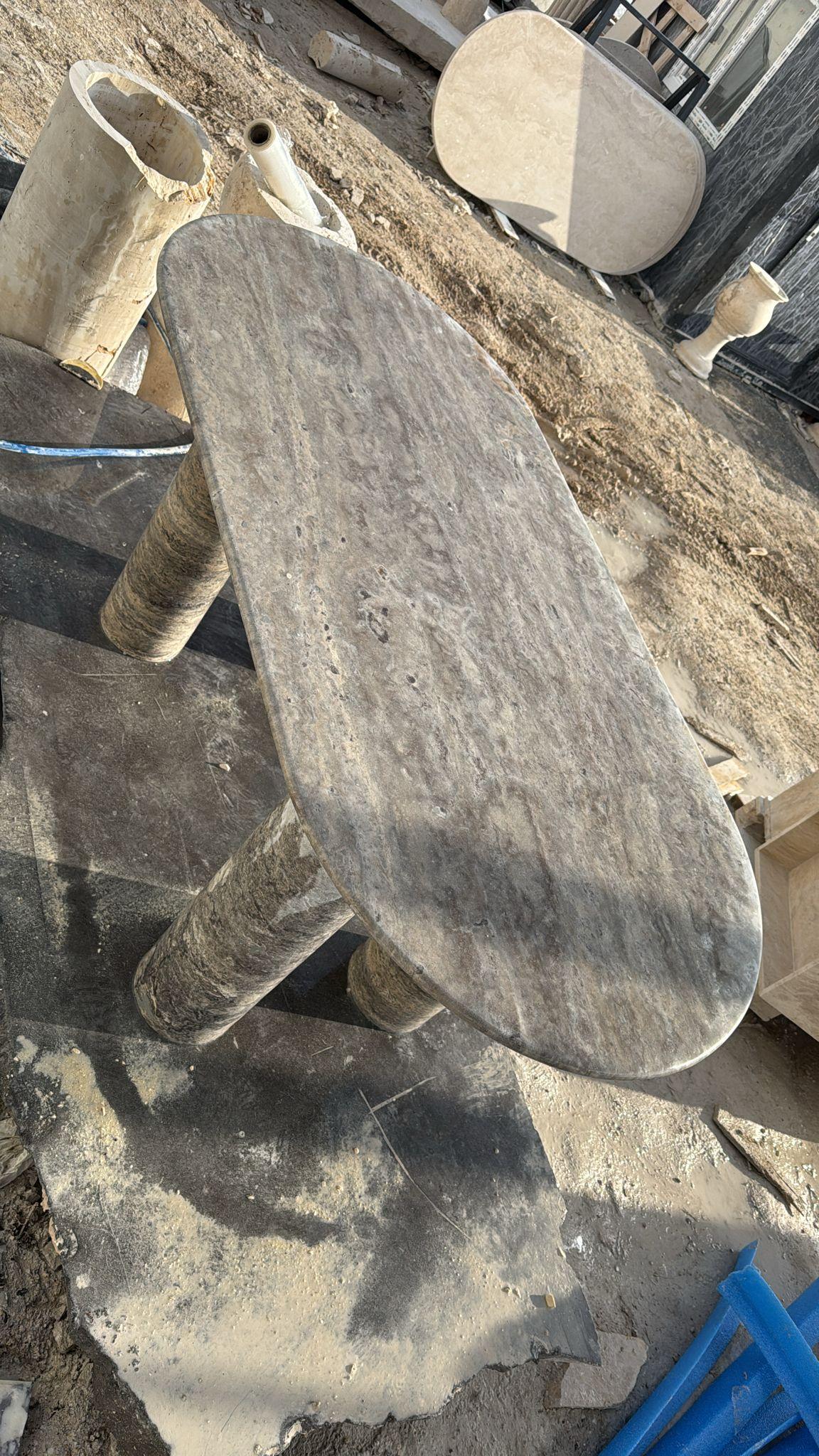 https://a.1stdibscdn.com/custom-oval-silver-travertine-marble-dining-table-stone-kitchen-tablle-for-sale-picture-4/f_91932/f_490694021772632942025/WhatsApp_Image_2026_03_04_at_16_00_16_1__master.jpeg