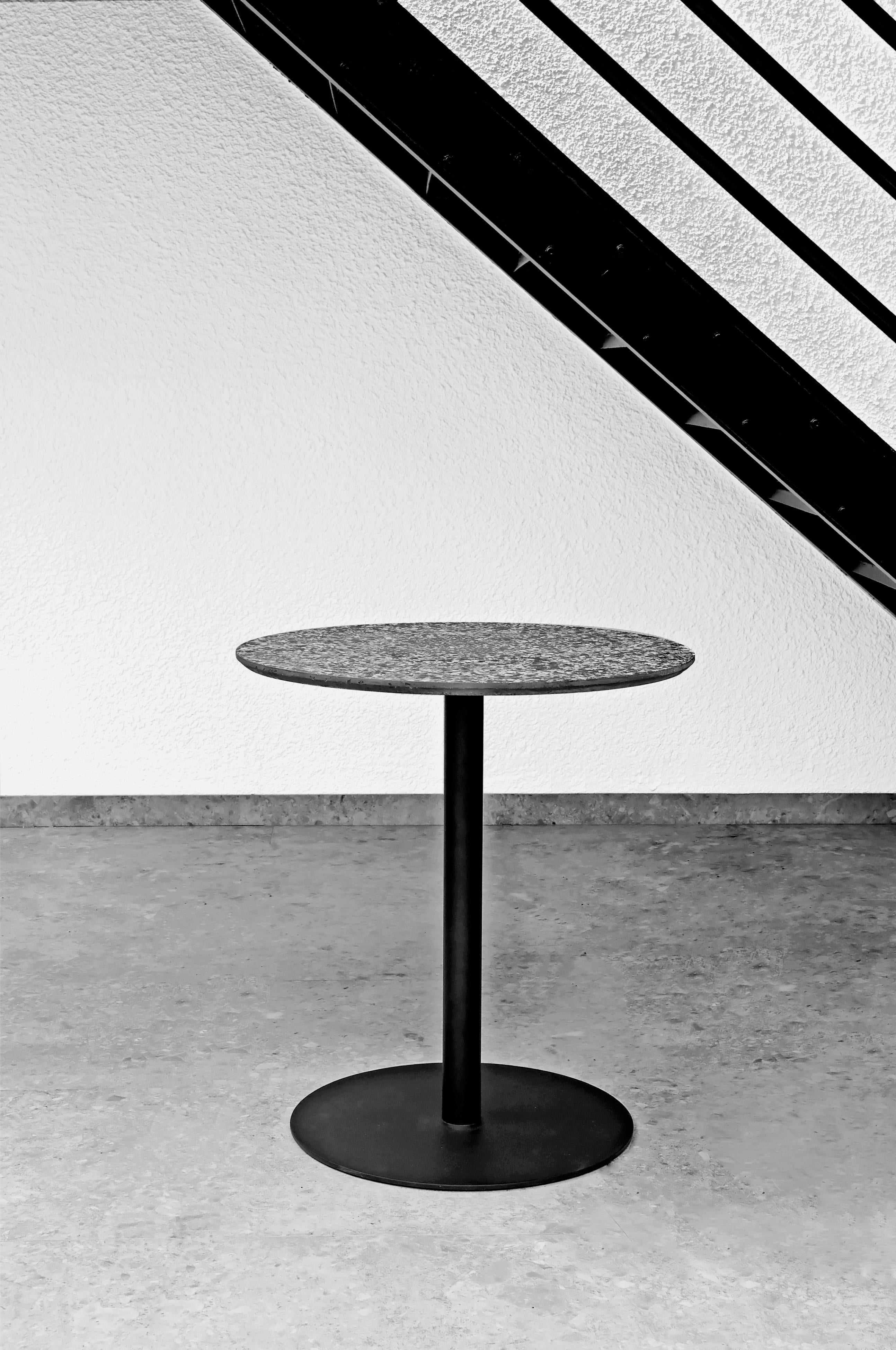 https://a.1stdibscdn.com/round-dining-table-i-in-white-terrazzo-for-sale-picture-3/f_31233/f_170459911574864477072/XLBOOM_LOOKBOOK_TERRAZZO_TABLEBLACK_master.jpg