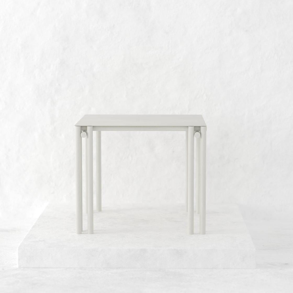 https://a.1stdibscdn.com/greige-dolmen-square-dining-table-for-sale-picture-2/f_90372/f_411262021724096974001/a59f76_7a656a9e384f49b0a1bac1977af24bfd_mv2_png_master.jpg