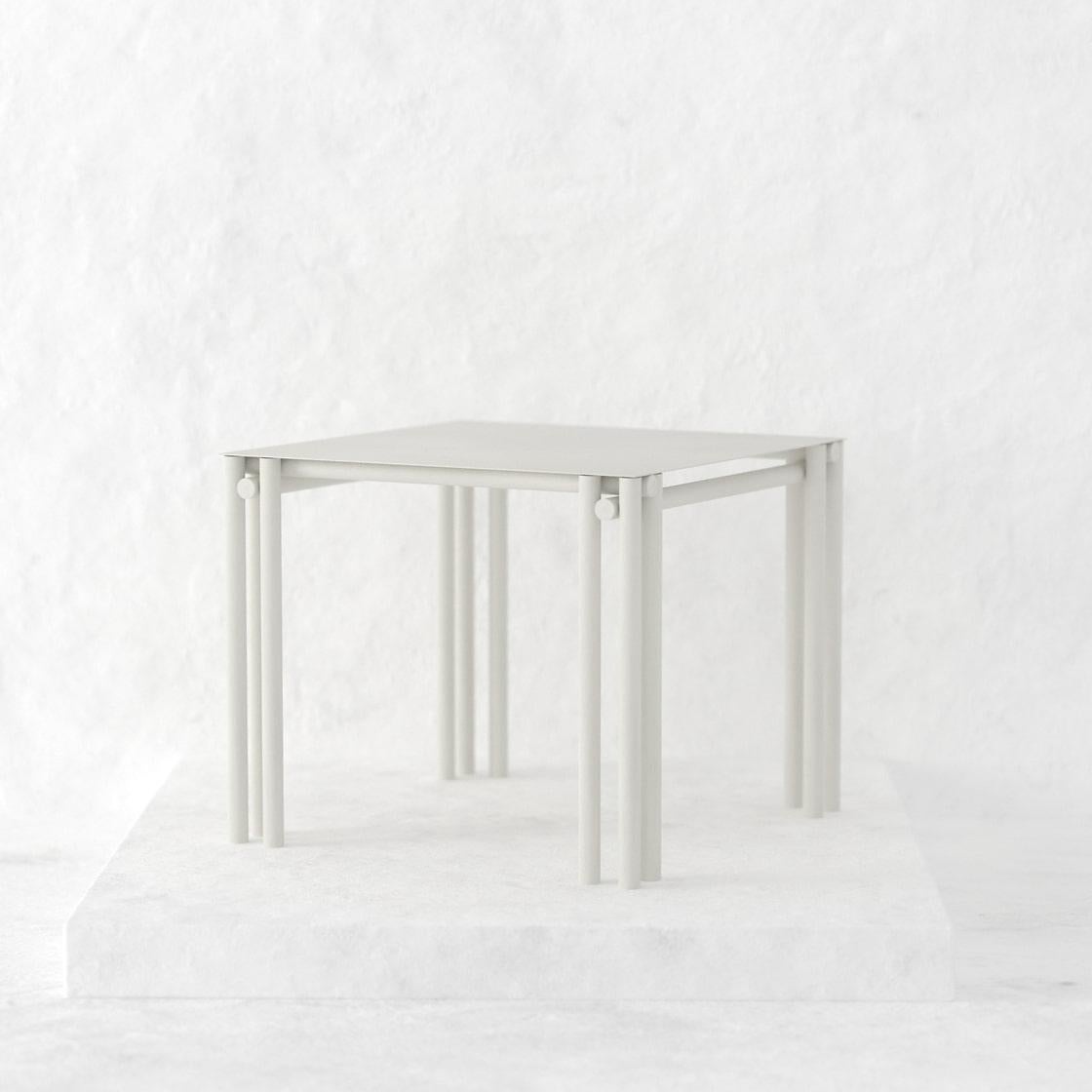 https://a.1stdibscdn.com/greige-dolmen-square-dining-table-for-sale-picture-3/f_90372/f_411262021724096973935/a59f76_929b95f9703f4665843ed737b51a5036_mv2_png_master.jpg