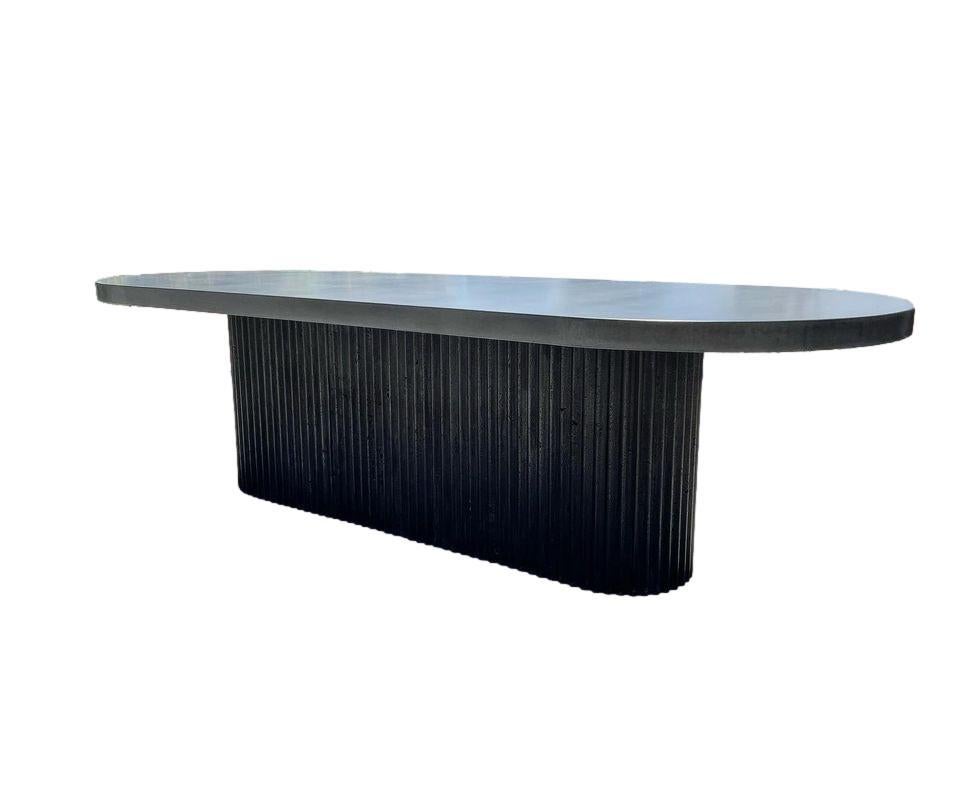 https://a.1stdibscdn.com/brutal-monolith-outdoor-concrete-dining-table-in-black-grey-finish-for-sale-picture-3/f_27693/f_376472521703020000251/actual__master.jpeg