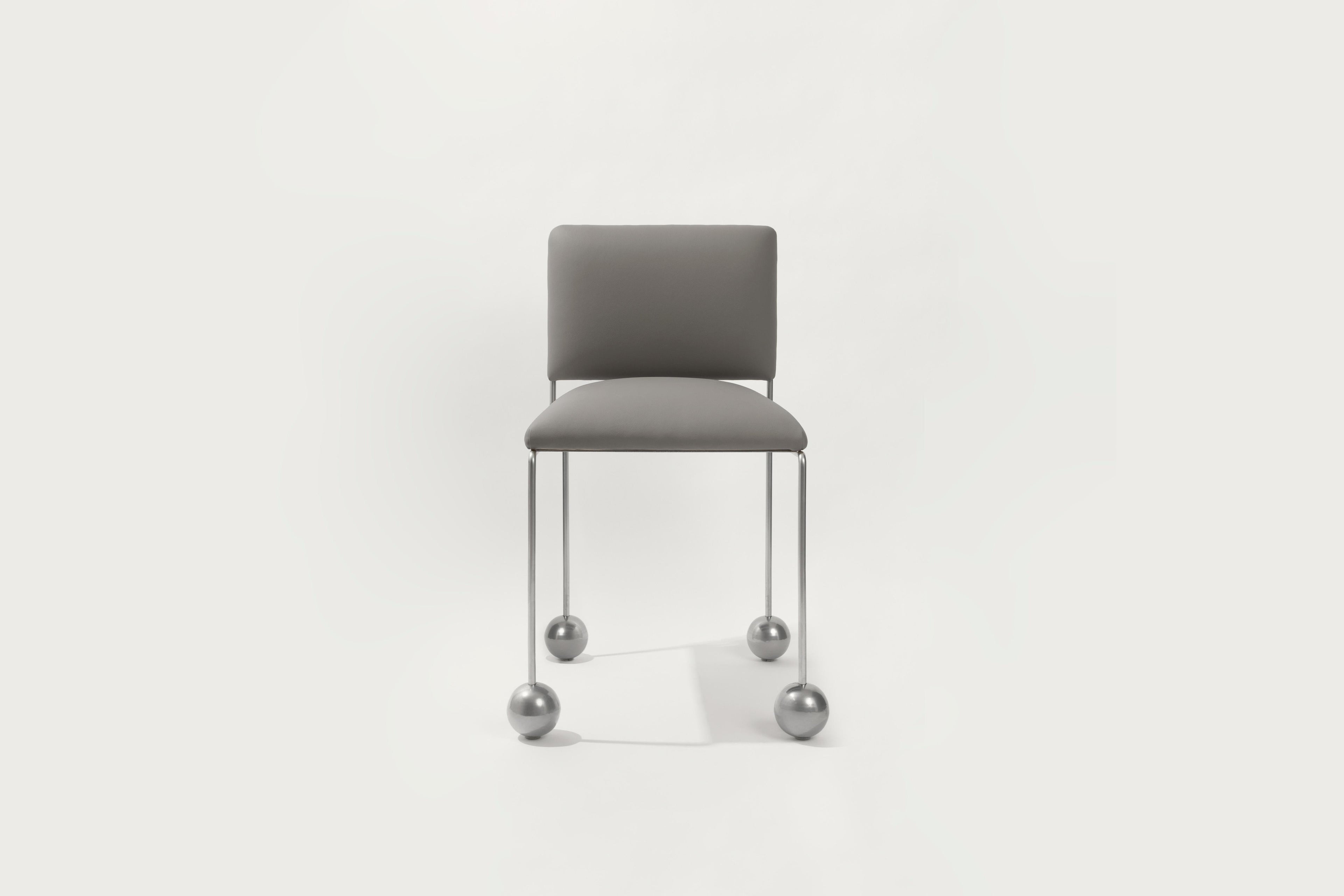 https://a.1stdibscdn.com/ball-foot-sculptural-chair-vegan-cactus-leather-burgundy-for-sale-picture-3/f_69682/f_487506221770745937934/ballfootchairgrey_master.jpg