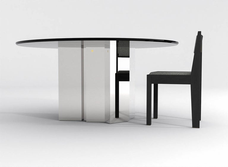 https://a.1stdibscdn.com/contemporary-round-dining-table-in-black-glass-and-high-polished-stainless-steel-for-sale-picture-5/f_48321/f_315445221669914154007/barh_not_so_blue_table_01_High_Gloss_Steel_x_Black_Glass_4_master.jpg?width=768