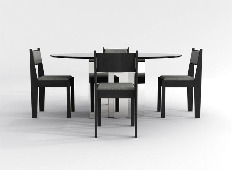 https://a.1stdibscdn.com/contemporary-round-dining-table-in-black-glass-and-high-polished-stainless-steel-for-sale-picture-6/f_48321/f_315445221669914154246/barh_not_so_blue_table_01_High_Gloss_Steel_x_Black_Glass_5_master.jpg?width=768