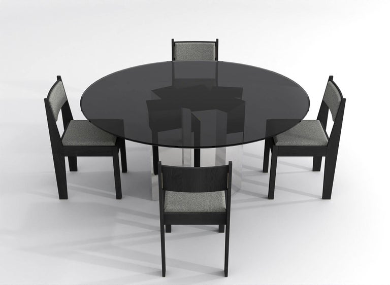https://a.1stdibscdn.com/contemporary-round-dining-table-in-black-glass-and-high-polished-stainless-steel-for-sale-picture-7/f_48321/f_315445221669914154243/barh_not_so_blue_table_01_High_Gloss_Steel_x_Black_Glass_6_master.jpg?width=768
