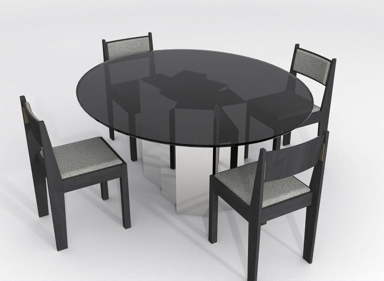https://a.1stdibscdn.com/contemporary-round-dining-table-in-black-glass-and-high-polished-stainless-steel-for-sale-picture-8/f_48321/f_315445221669914155351/barh_not_so_blue_table_01_High_Gloss_Steel_x_Black_Glass_7_master.jpg?width=768