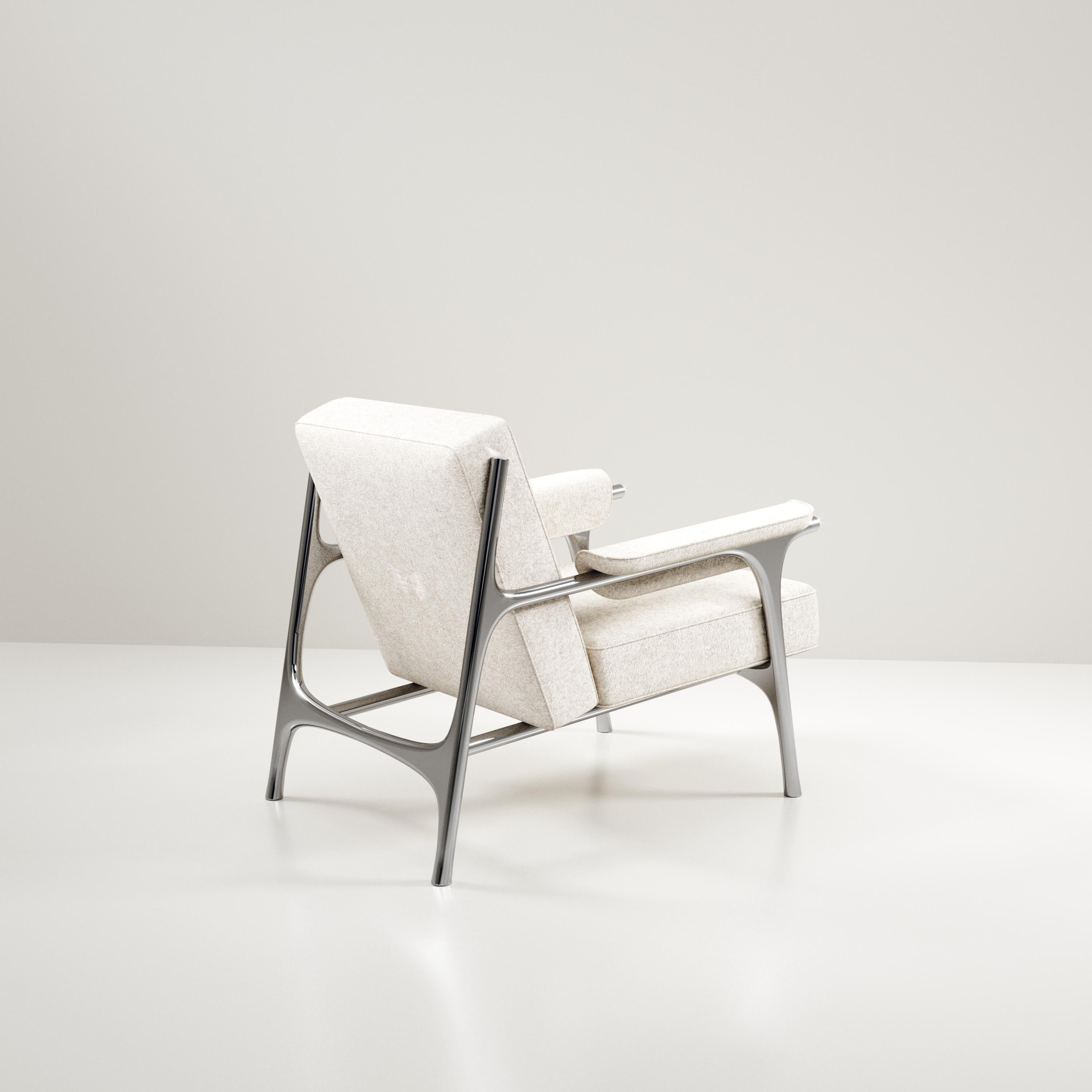 https://a.1stdibscdn.com/upholstered-armchair-with-chrome-finish-stainless-steel-details-by-ry-augousti-for-sale-picture-5/f_45491/f_354985521690872286794/chair_OPT_PLUMERIA0003_master.jpg