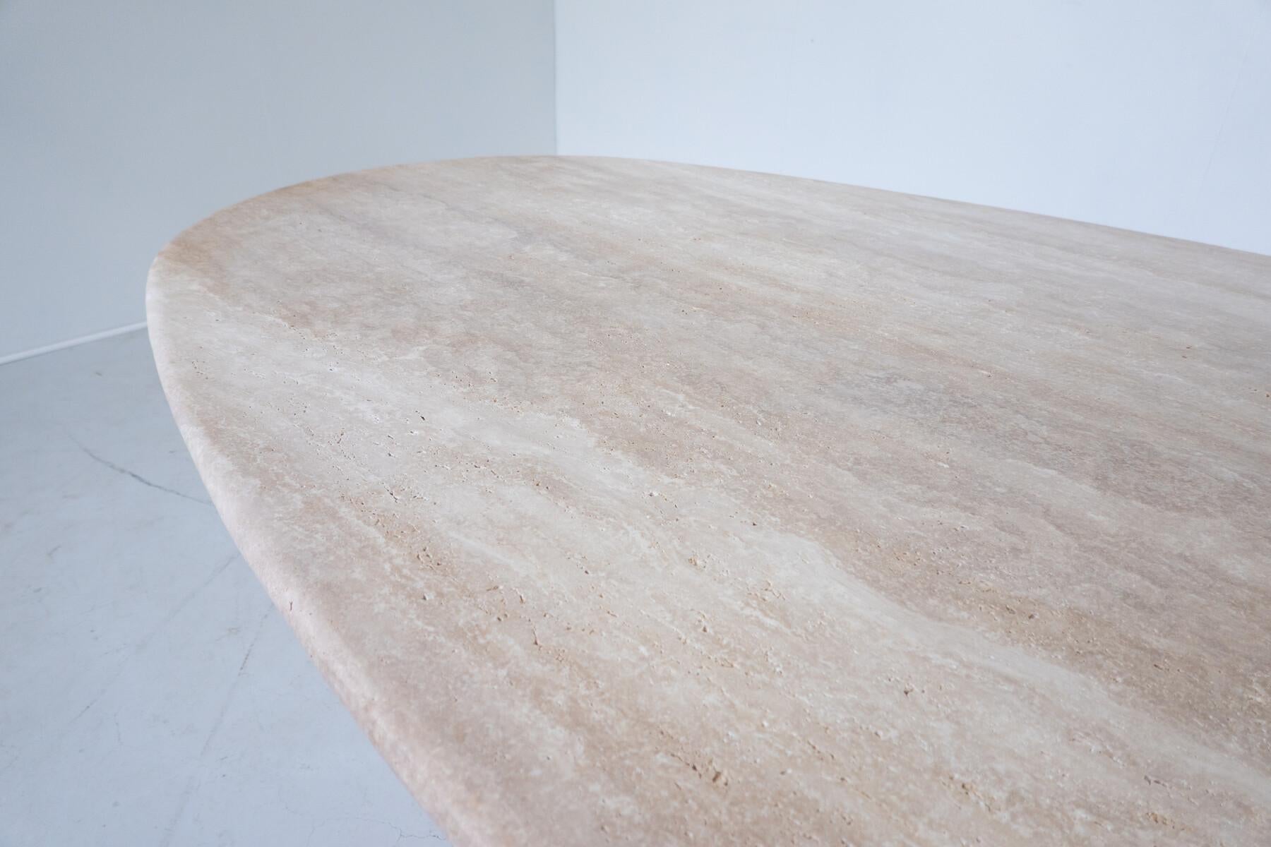https://a.1stdibscdn.com/contemporary-large-travertine-dining-table-for-sale-picture-5/f_22653/f_440474721741970745513/contemporary_large_travertine_dining_table_18261707_en_max_master.jpg