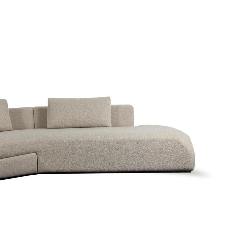 https://a.1stdibscdn.com/elara-sofa-celestial-duality-meets-composed-lounge-for-sale-picture-5/f_103682/f_450155221747199311808/curved_beige_sofa_view_2_master.jpg