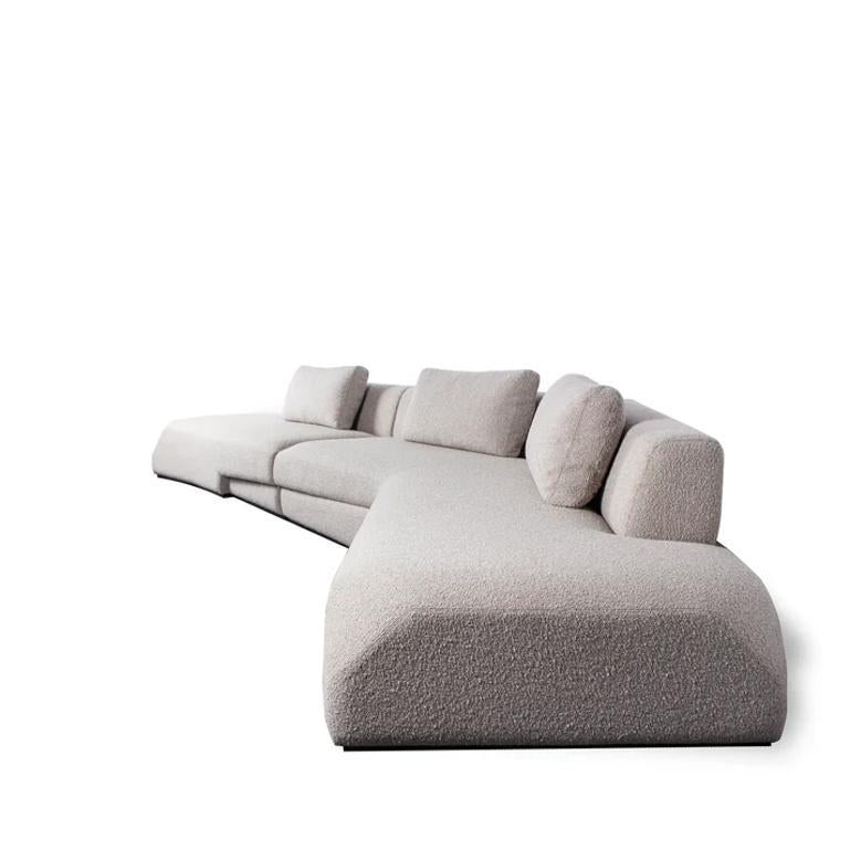 https://a.1stdibscdn.com/elara-sofa-celestial-duality-meets-composed-lounge-for-sale-picture-2/f_103682/f_450155221747199298459/curved_beige_sofa_view_3_master.jpg
