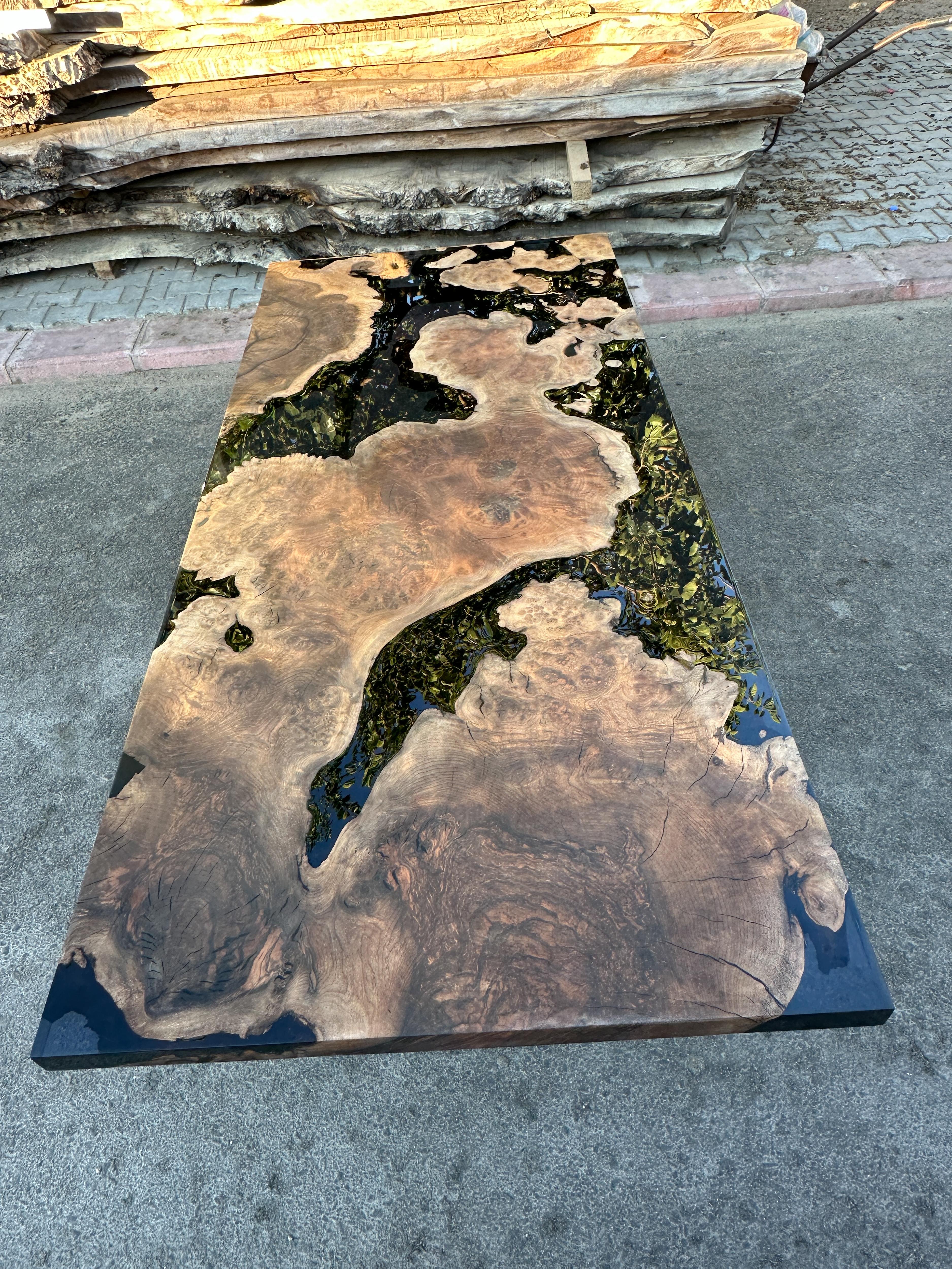 https://a.1stdibscdn.com/oval-dining-table-black-resin-river-root-walnut-wood-table-for-sale-picture-3/f_91932/f_411725421724402438791/epoxy_resin_wood_table_art_handmade_024_master.JPG