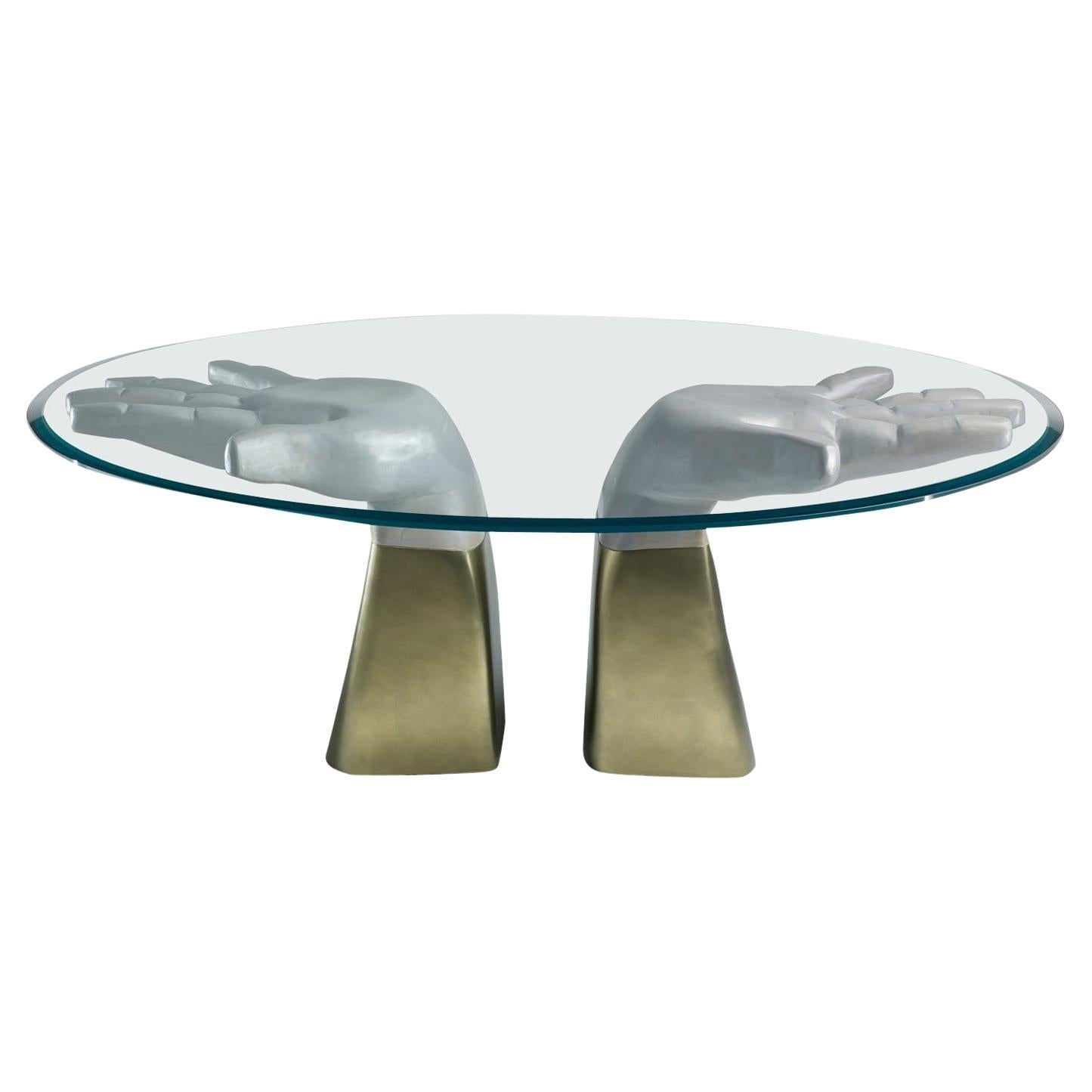 https://a.1stdibscdn.com/prego-gold-carved-dining-table-composed-of-two-wooden-hands-and-glass-top-for-sale/f_46131/f_156439321694786315033/f_15643932_1694786315447_bg_processed.jpg