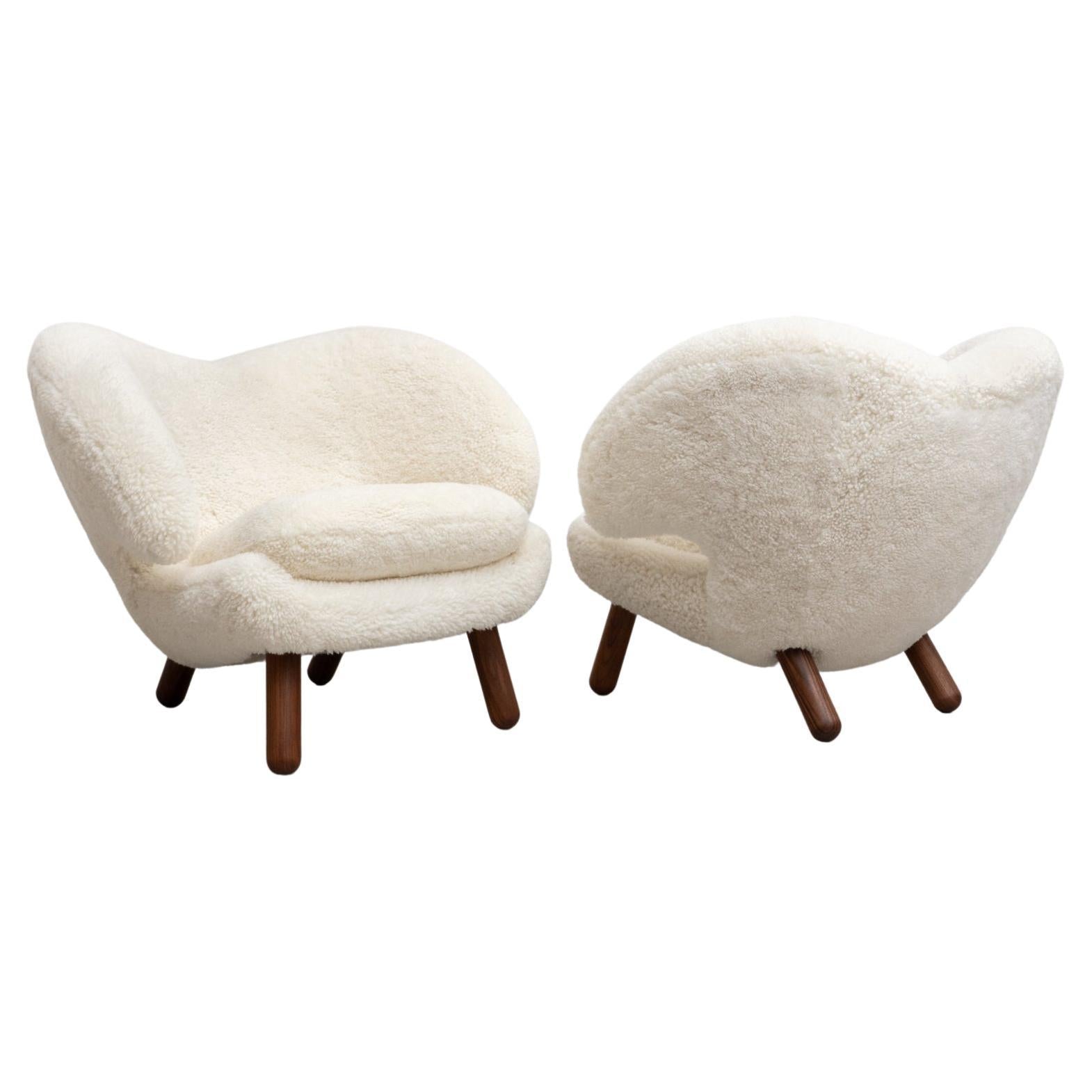 https://a.1stdibscdn.com/set-of-two-finn-juhl-pelican-chair-upholstered-in-gotland-sheepskin-for-sale/f_14272/f_265775721639735404735/f_26577572_1639735405117_bg_processed.jpg