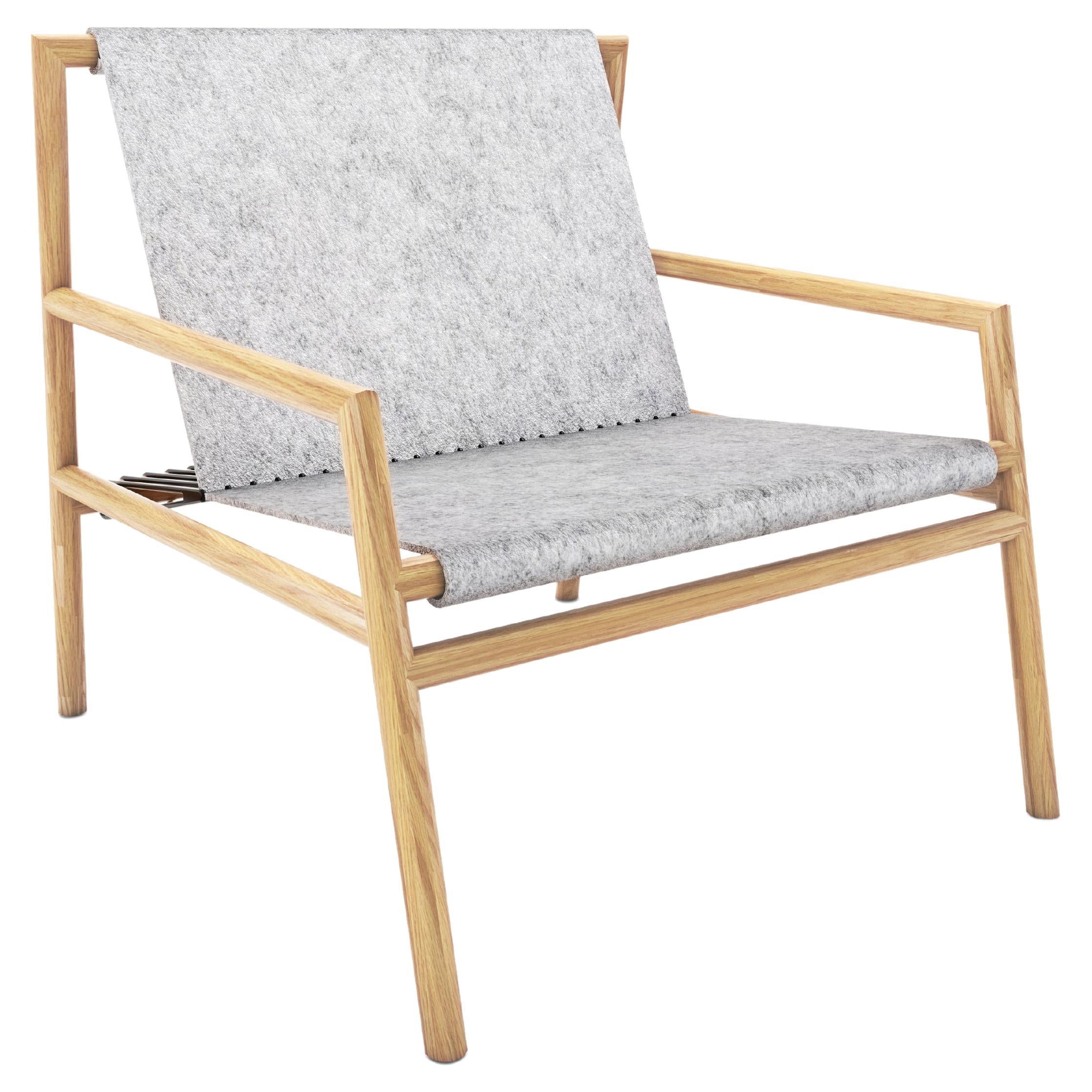 https://a.1stdibscdn.com/gallagher-lounge-chair-oak-wood-and-grey-felt-for-sale/22569652/f_266329421640078102791/f_26632942_1640078103562_bg_processed.jpg