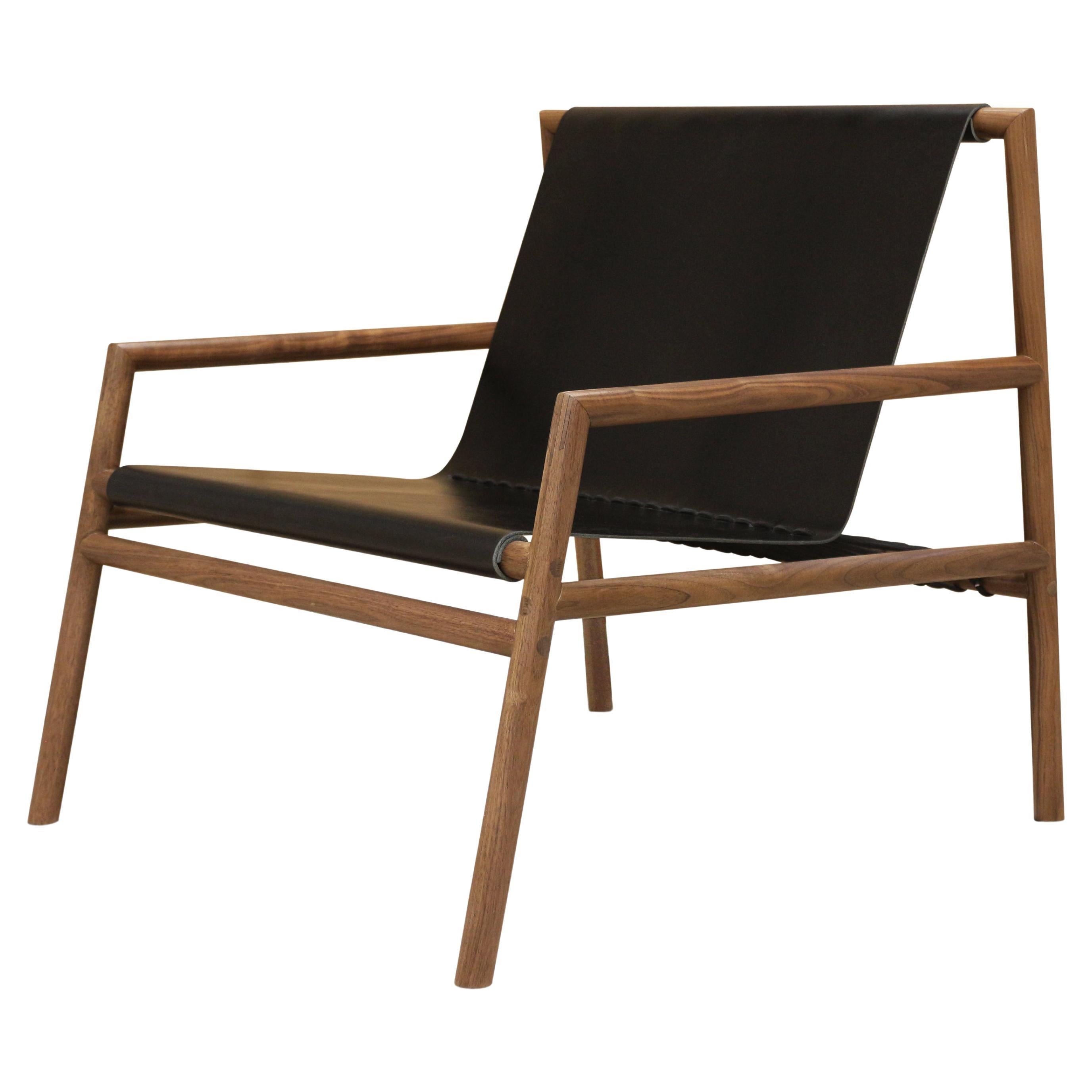 https://a.1stdibscdn.com/gallagher-lounge-chair-walnut-black-leather-for-sale/f_60402/f_266330121643746715941/f_26633012_1643746716888_bg_processed.jpg