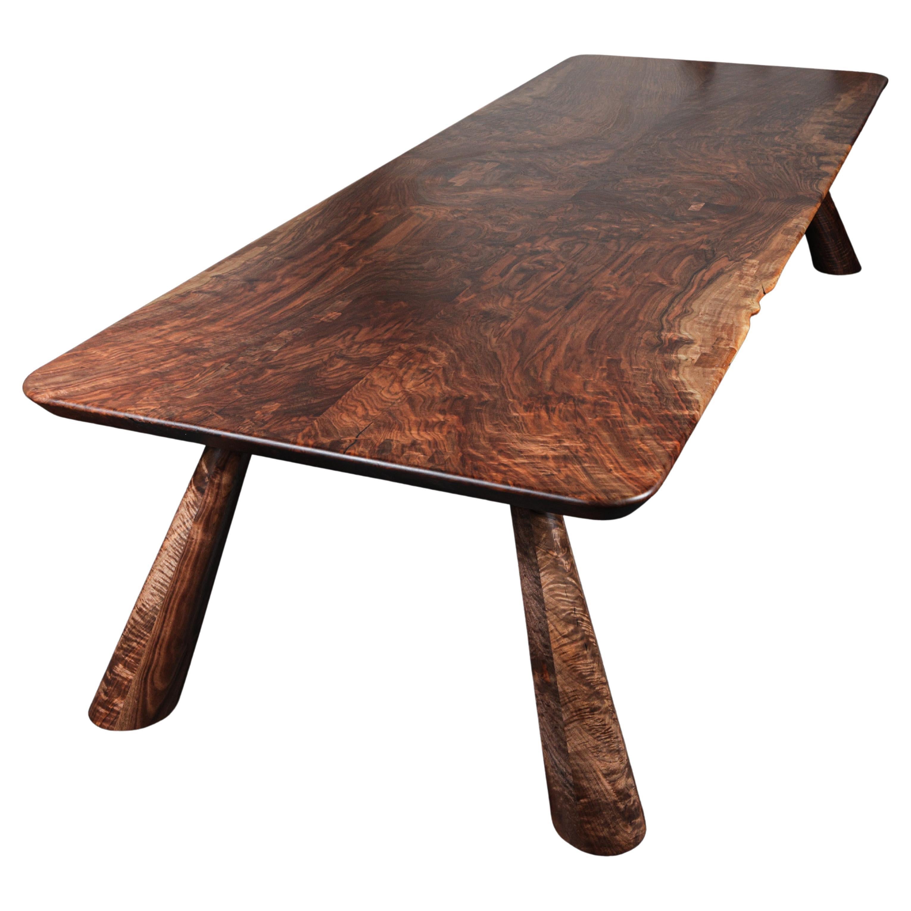 https://a.1stdibscdn.com/claro-walnut-bookmatched-fijn-dining-table-in-stock-for-sale/f_51472/f_274761621645482358299/f_27476162_1645482359705_bg_processed.jpg