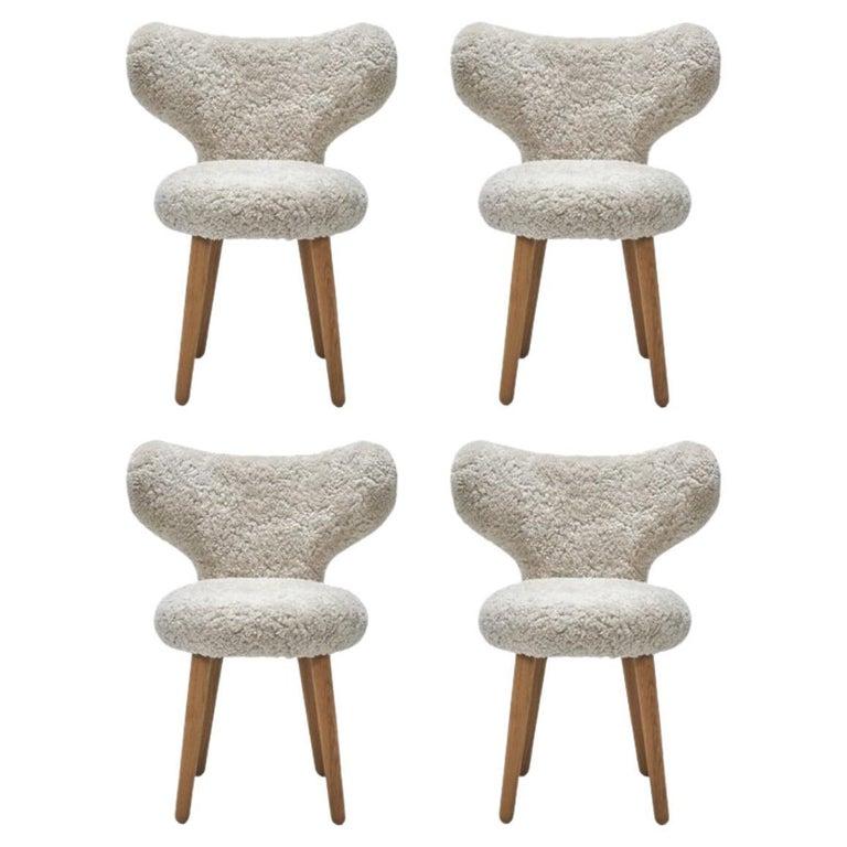 https://a.1stdibscdn.com/set-of-4-sheepskin-wng-chairs-by-mazo-design-for-sale-picture-2/f_12192/f_325167321675170141106/f_27628002_1646412293855_bg_processed_master.jpg