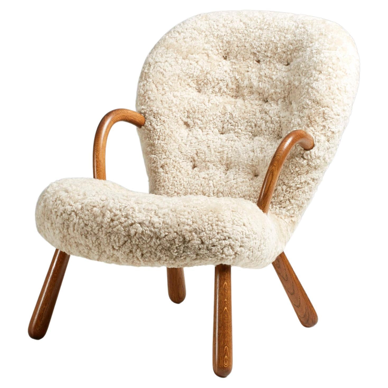 https://a.1stdibscdn.com/arnold-madsen-sheepskin-clam-chair-1944-for-sale/f_67442/f_286035721652207604211/f_28603572_1652207604774_bg_processed.jpg