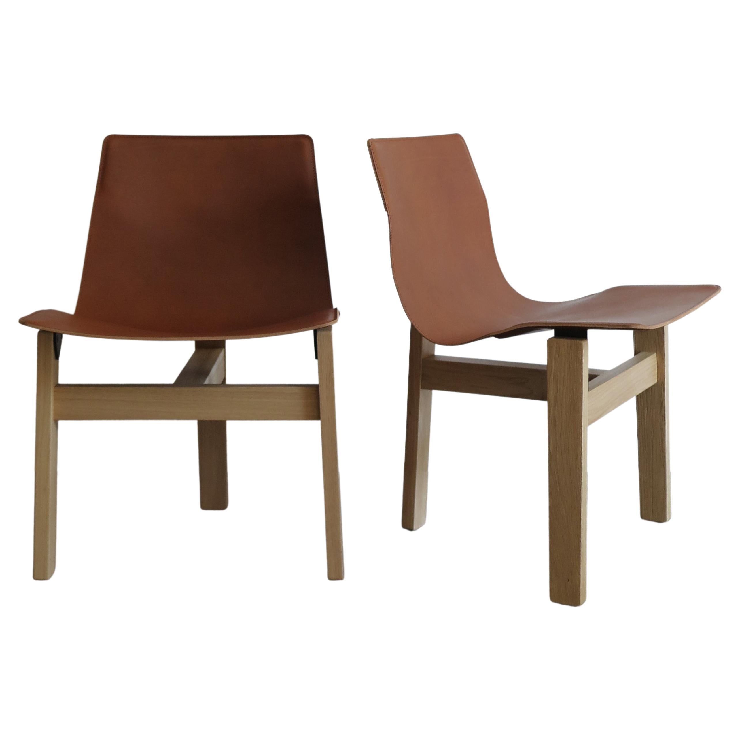 https://a.1stdibscdn.com/angelo-mangiarotti-italian-leather-and-wood-dining-chairs-for-agapecasa-for-sale/f_33883/f_286152021652275362315/f_28615202_1652275363256_bg_processed.jpg