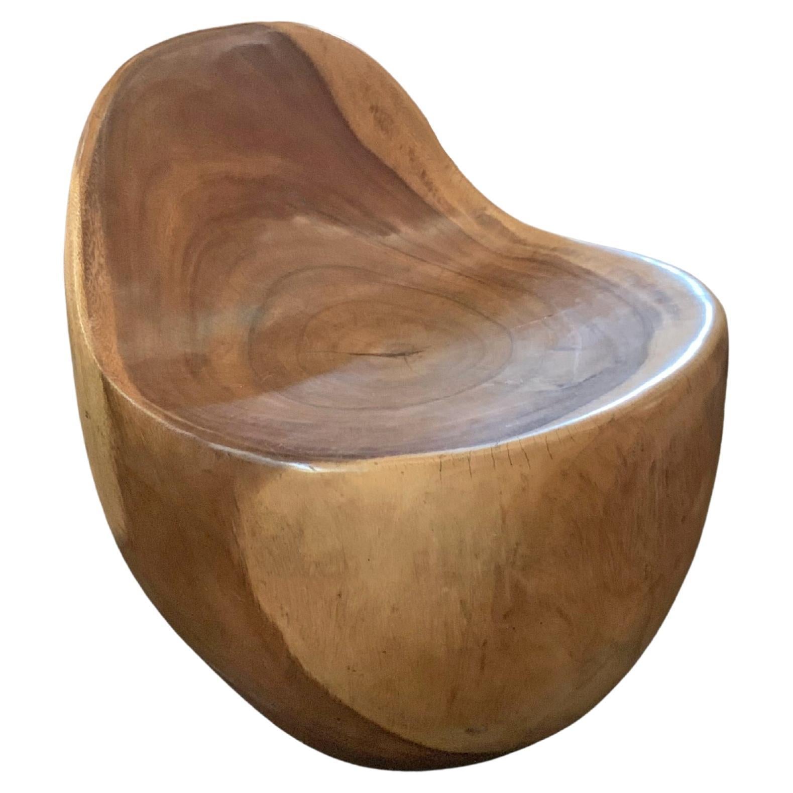 https://a.1stdibscdn.com/sculptural-lounge-chair-carved-from-solid-mango-wood-for-sale/f_58812/f_286893021652775893933/f_28689302_1652775894625_bg_processed.jpg