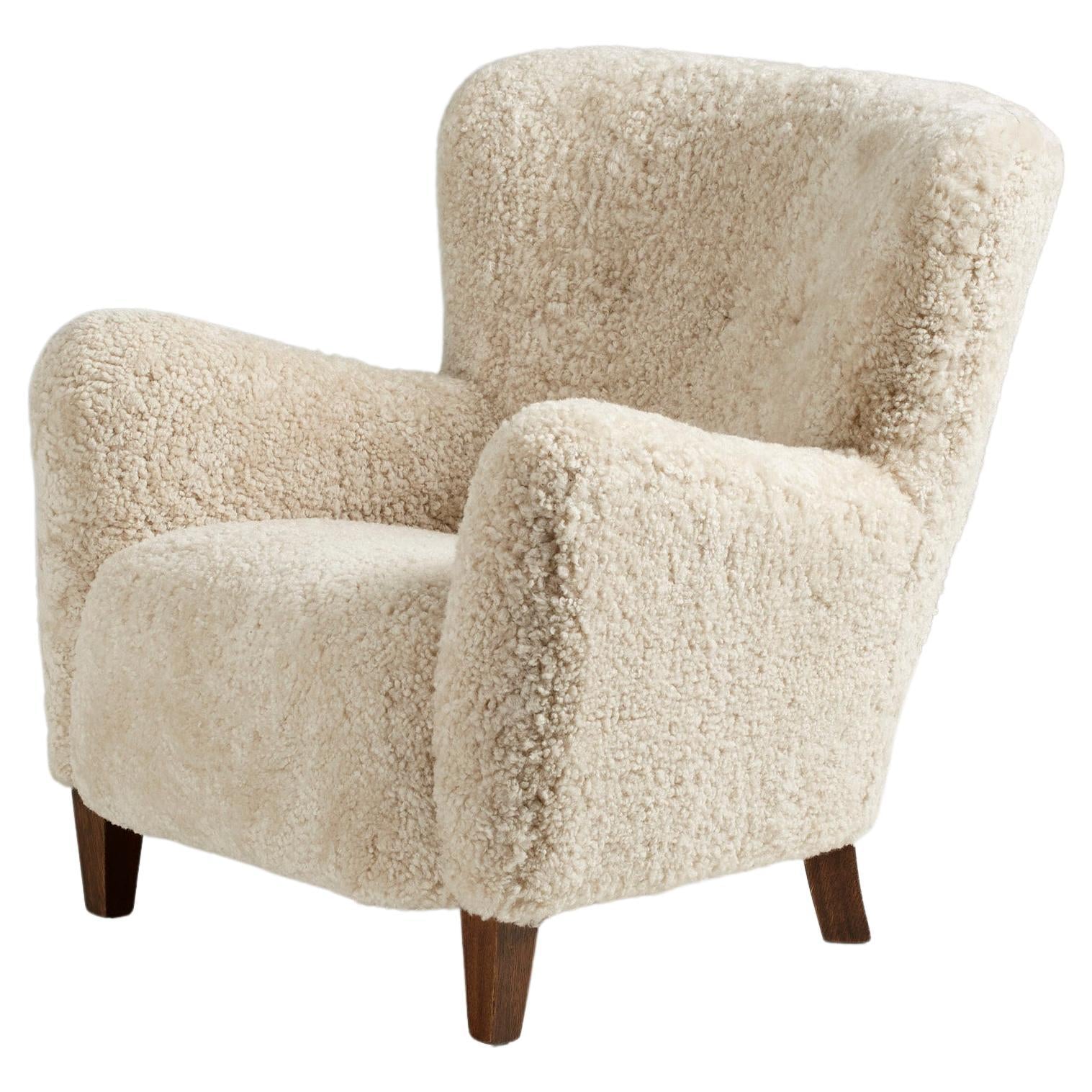 https://a.1stdibscdn.com/custom-made-ryo-sheepskin-lounge-chair-for-sale/f_67442/f_289408121654196531188/f_28940812_1654196531728_bg_processed.jpg