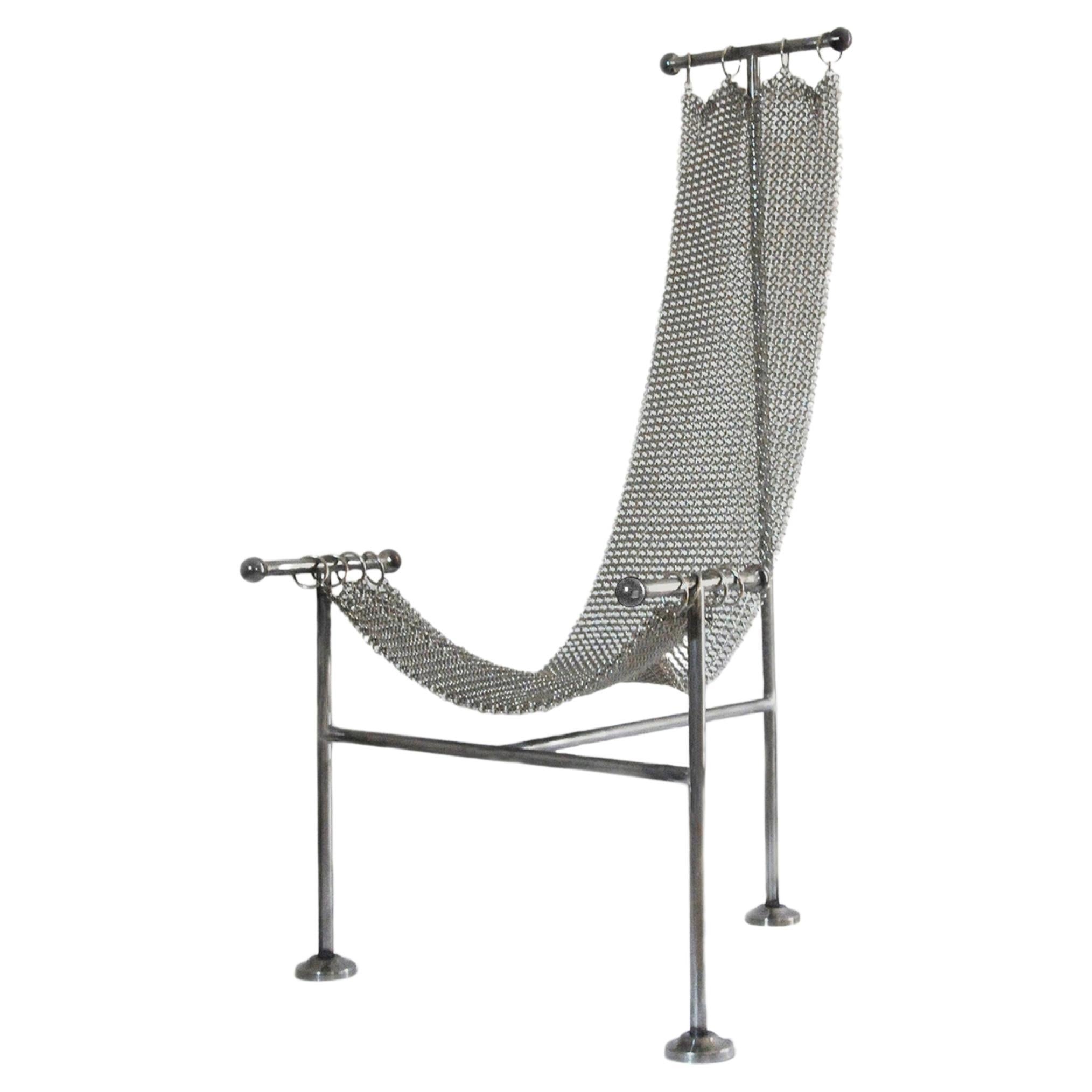 https://a.1stdibscdn.com/chainmail-sculptural-chair-nickel-plated-steel-finish-hand-linked-mesh-for-sale/f_69682/f_361508621694644904782/f_29228892_1655911265139_bg_processed.jpg