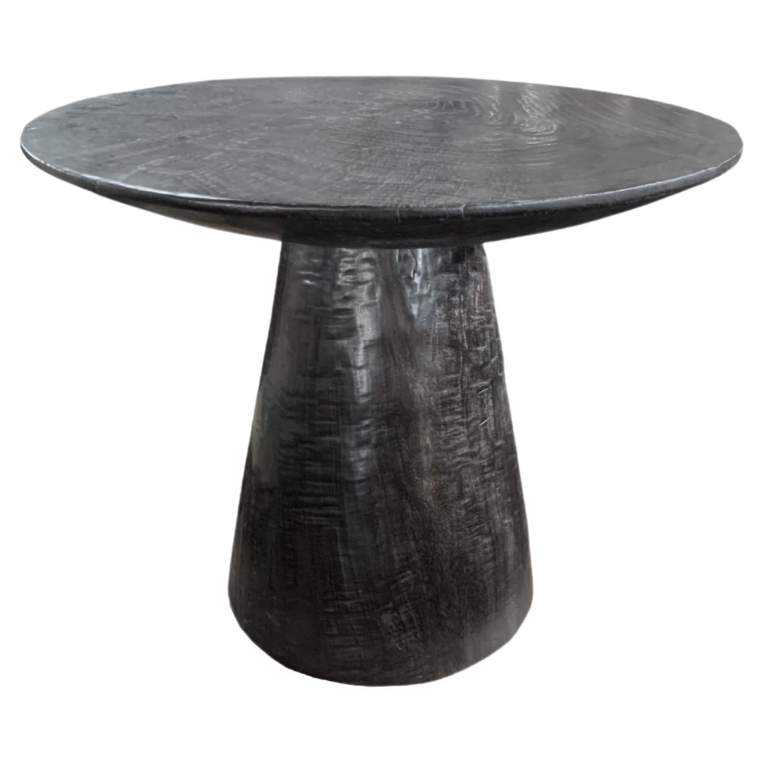 https://a.1stdibscdn.com/sculptural-round-table-crafted-from-mango-wood-burnt-finish-modern-organic-for-sale/f_58812/f_295375221657627814997/f_29537522_1657627815462_bg_processed.jpg