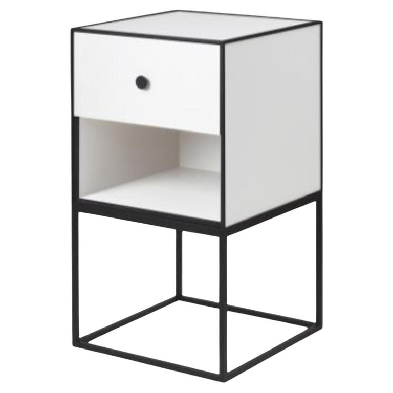 https://a.1stdibscdn.com/35-white-frame-sideboard-with-1-drawer-by-lassen-for-sale/f_12192/f_329536021677250829102/f_29690912_1658495488124_bg_processed.jpg?width=768